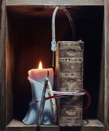 A lit candle, stacked worn books, blue drapery, metal instruments, and clear tubing occupy a dark wooden alcove.