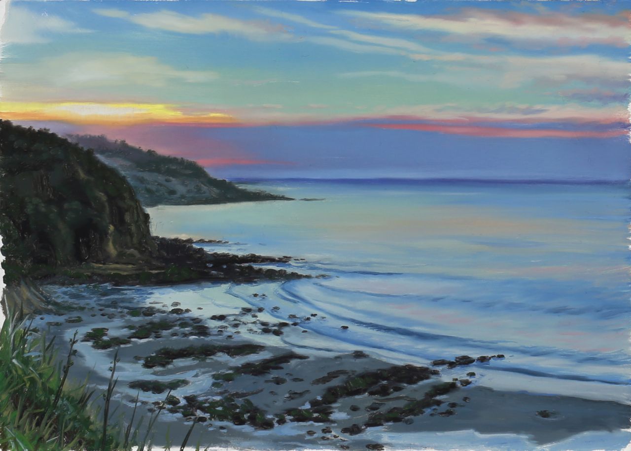 A coastal sunset painting with dark cliffs, a rocky beach, calm blue water, and a pastel pink, yellow, and turquoise sky.