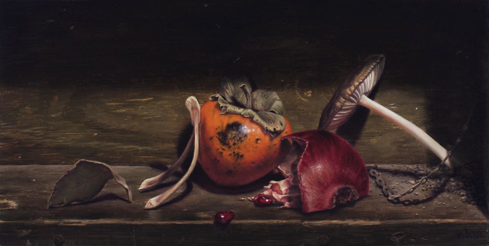 Dark still life of a persimmon, split pomegranate, mushrooms, curled leaves, scattered seeds, and a short chain on a wooden ledge.