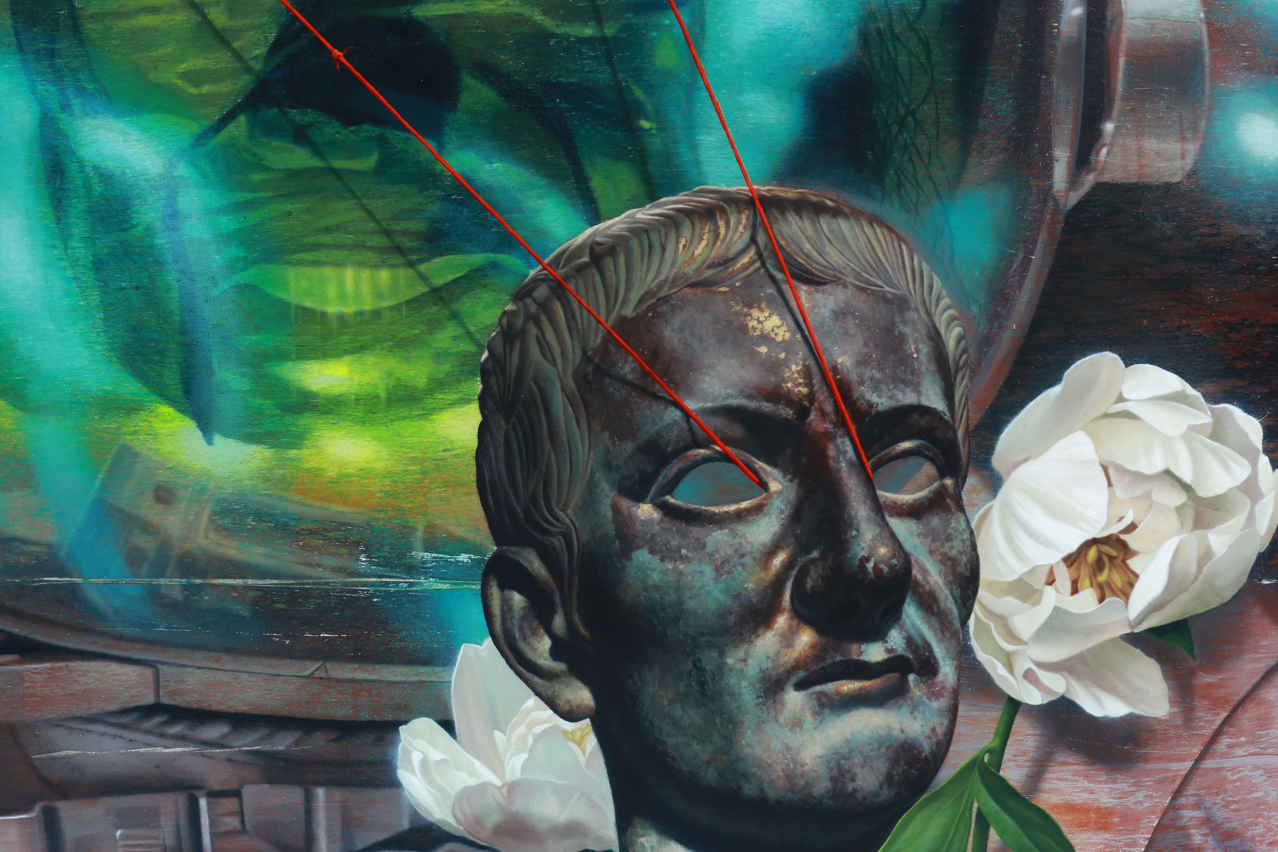 Close detail of white flowers and dark roman bust sculpture in front of turquoise-green horizontal streaks, crossed by a thin red cord.
