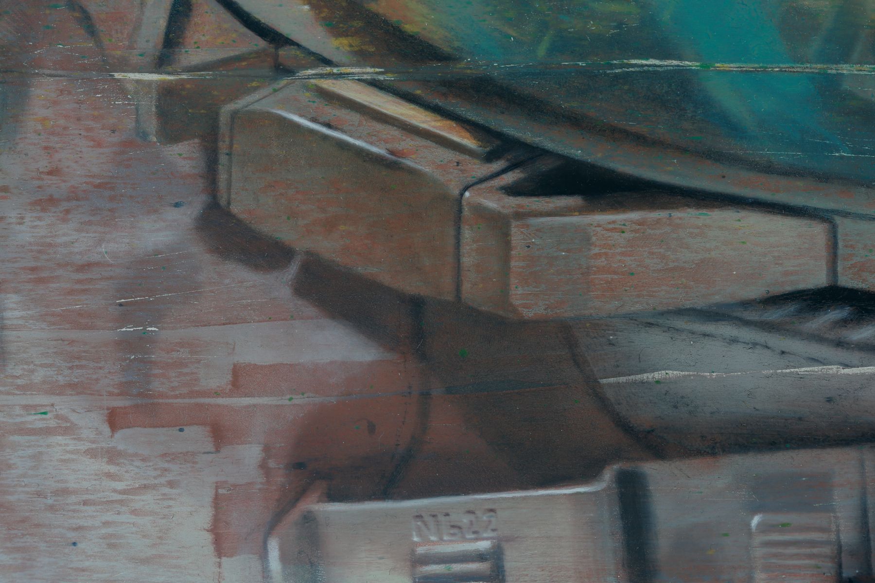 Close detail of overlapping turquoise, charcoal, rust, and gray angular forms, with curved dark bands and softly textured, weathered surfaces.