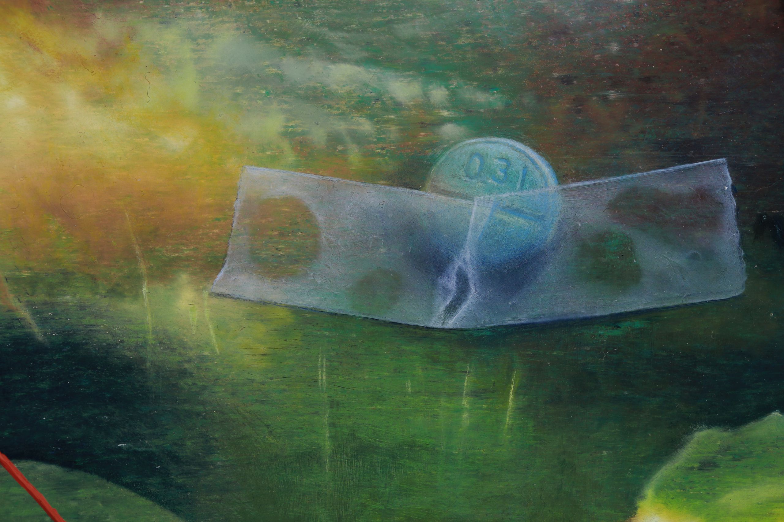 Close detail of an abstract painting with a blue pill held by translucent tape and layered green, yellow, and dark horizontal bands, pale blue curves.