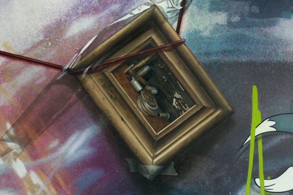 A tilted gold frame containing small metallic objects lies amid fractured, smoky purple-blue planes, red rods, green drips, and a cropped cartoon figure.