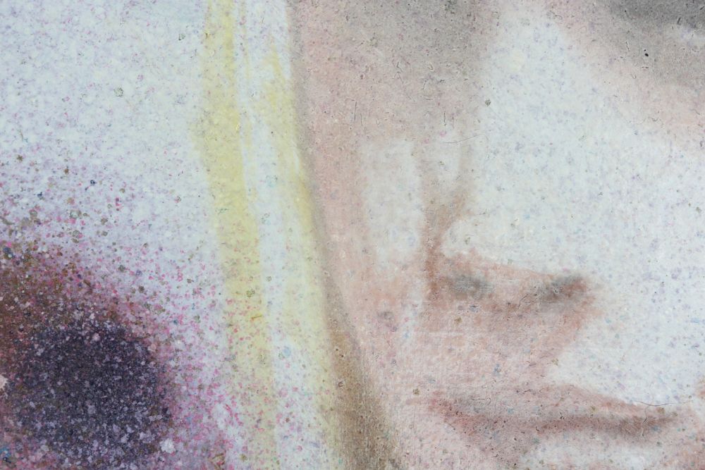 Close detail of a mottled abstract painting with pale blue, yellow, and pink washes, a dark purple corner, and faint brown angular forms.