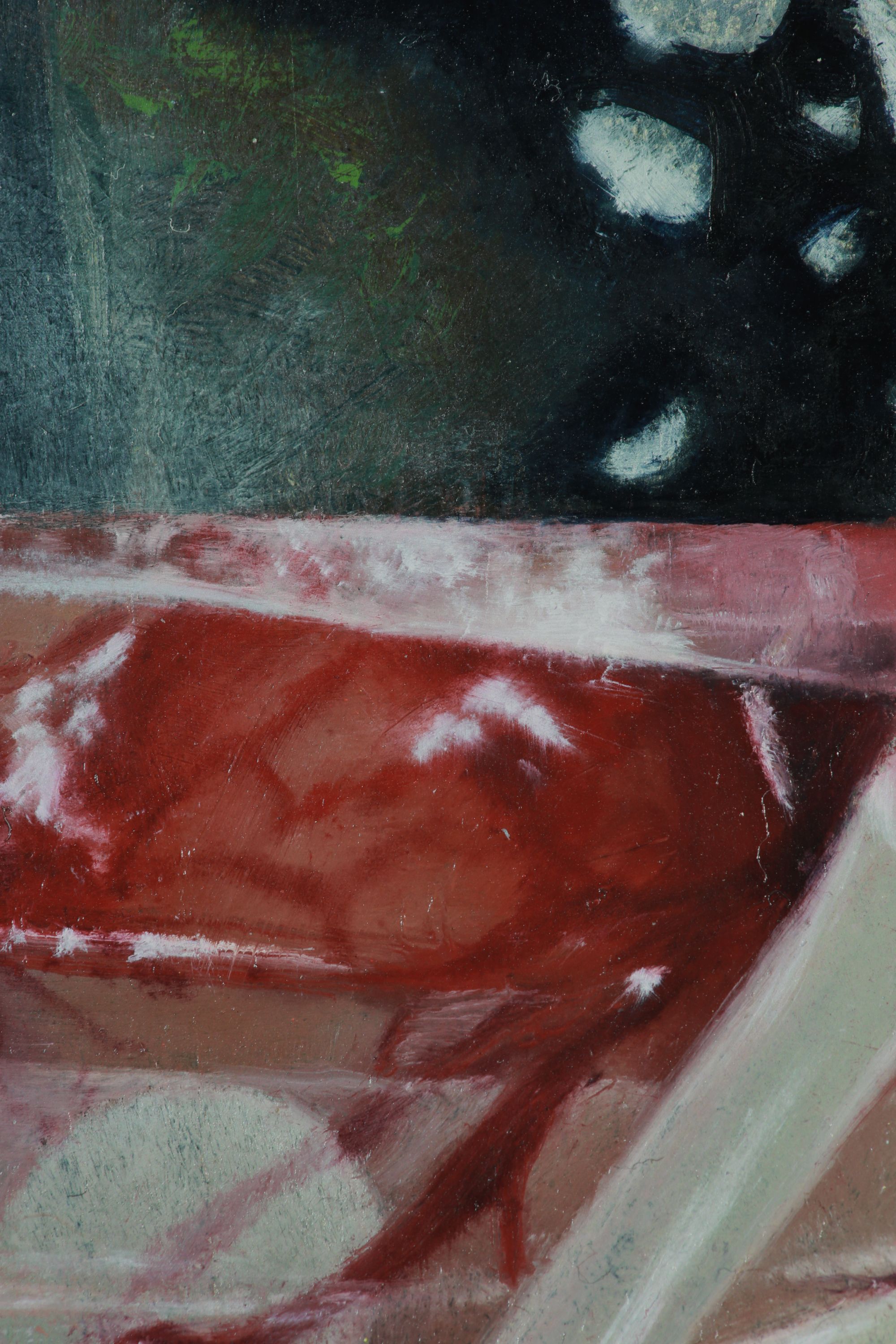 Close detail of an abstract painting with dark green-black forms above layered red, pink, and white angular brushstrokes.