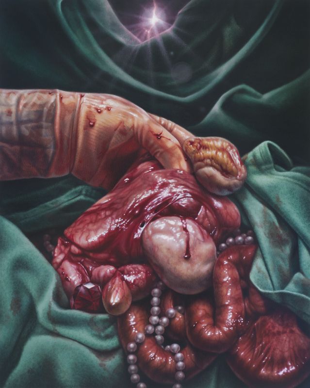 A bloodied forearm and curled hand holding up glistening organs, intestines, pearl-like beads, and a red gem amid dark green drapery.