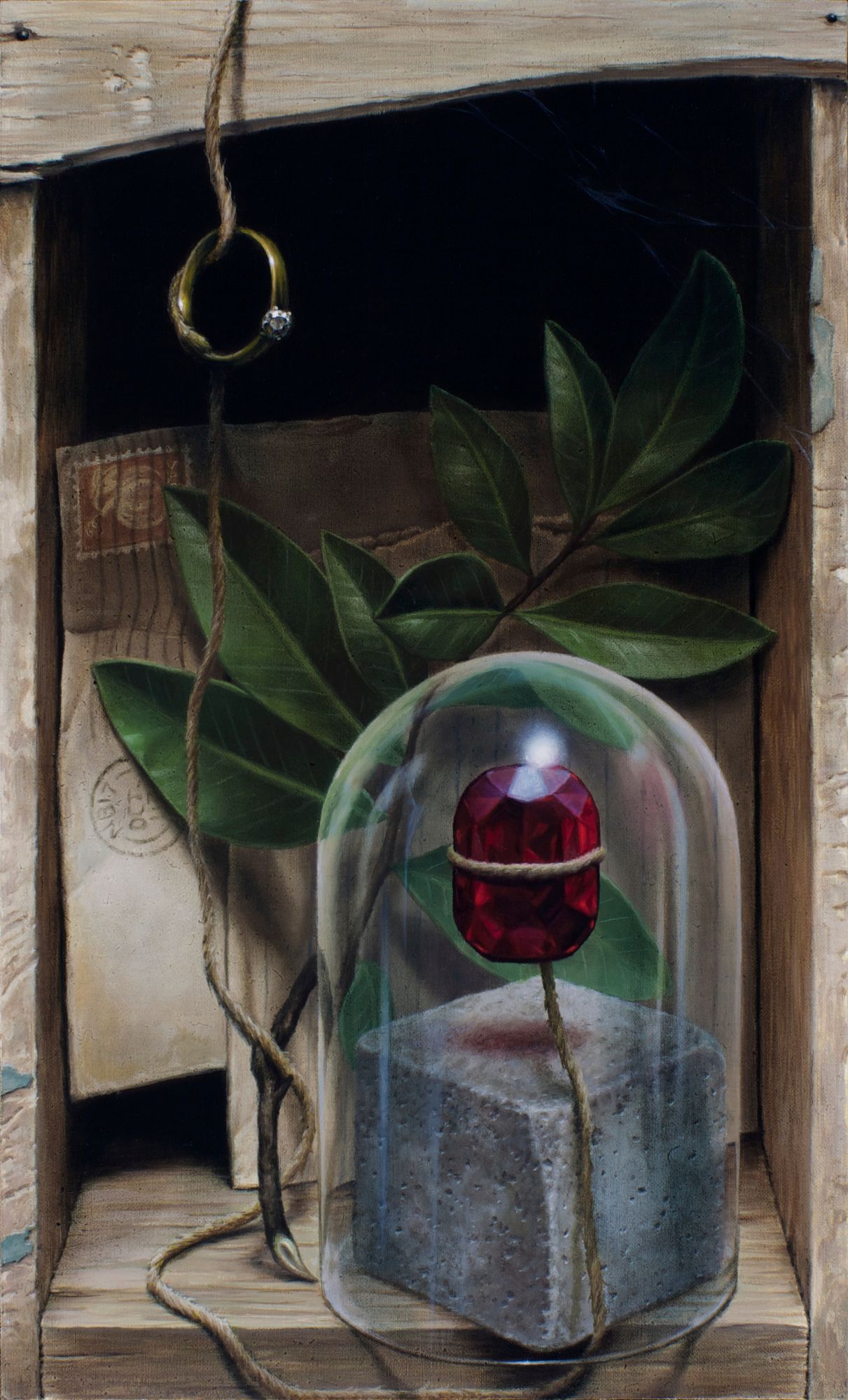 A faceted red gemstone bound with twine sits under a glass dome, framed by green leaves, a hanging gold ring, and wooden boards.