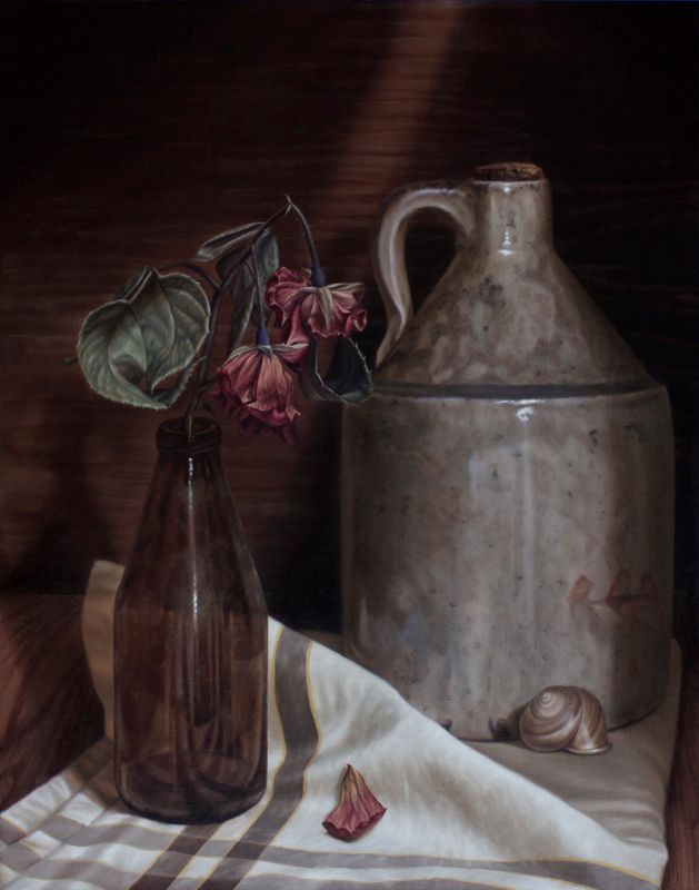 Still life of wilted pink flowers in a brown bottle beside a large grey jug, striped cloth, fallen petal, and snail shell.