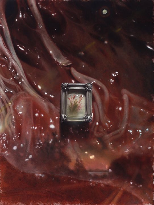 A small ornate silver frame enclosing pale dried flowers sits centrally amid glossy, tendon and flesh forms and scattered white highlights.
