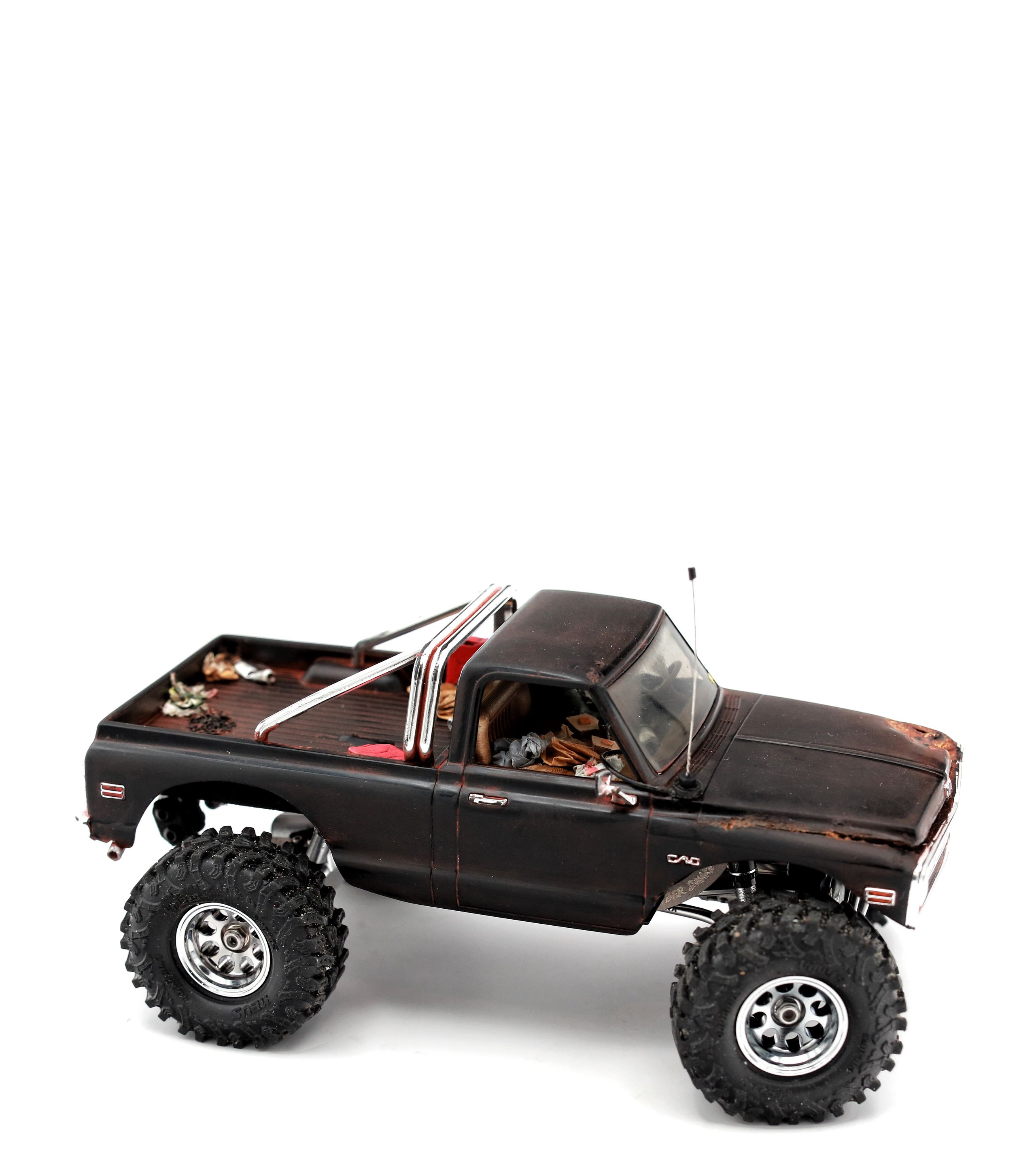 1/30 scale1/30 scale Chevy C10 beater RC truck with custom DIY rear leaf spring suspension system.