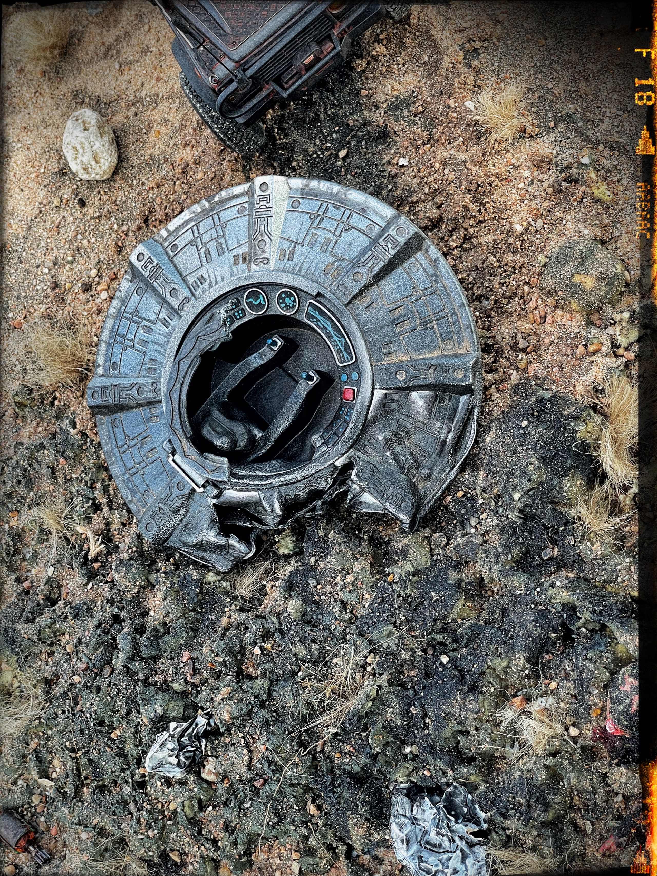 1/24 scale diorama with UFO depicting the Roswell Incident, with desert landscape made from found materials, real dirt and rocks, modeling supplies, with 1/24 scale rugged overlanding Land Rover Defender 110.