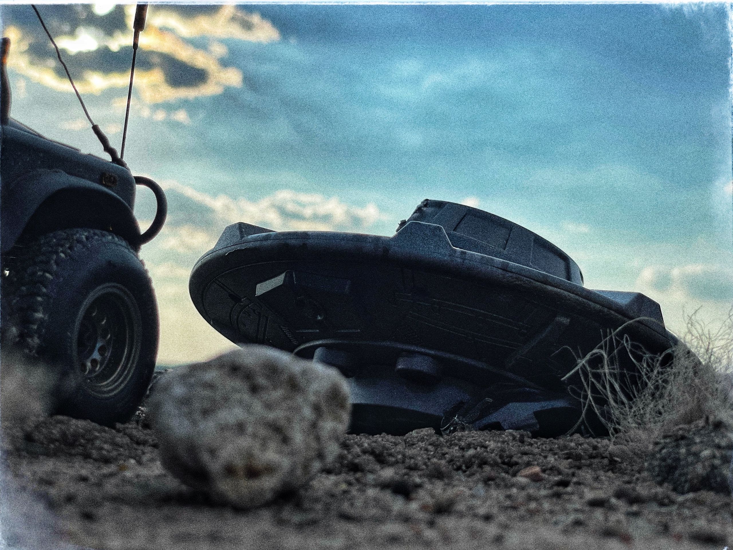 1/24 scale diorama with UFO depicting the Roswell Incident, with desert landscape made from found materials, real dirt and rocks, modeling supplies, with 1/24 scale rugged overlanding Land Rover Defender 110.