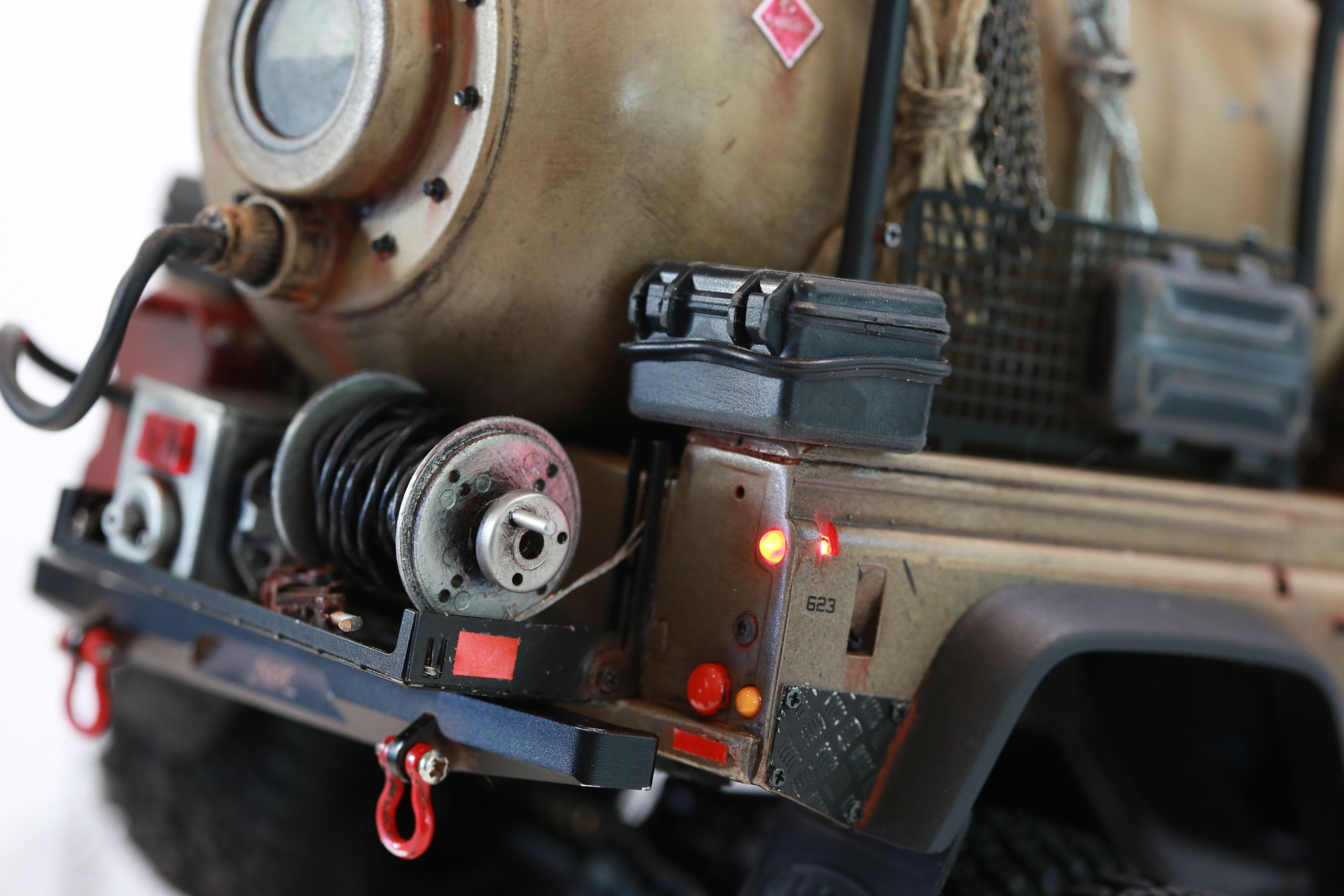 The Land Rover Defender Resource Recovery Vehicle (RRV) is an imagined 1/18 scale post-apocalyptic tanker truck that roams the industrial wasteland harvesting fuel from abandoned sites for transport back to the survivor encampment.