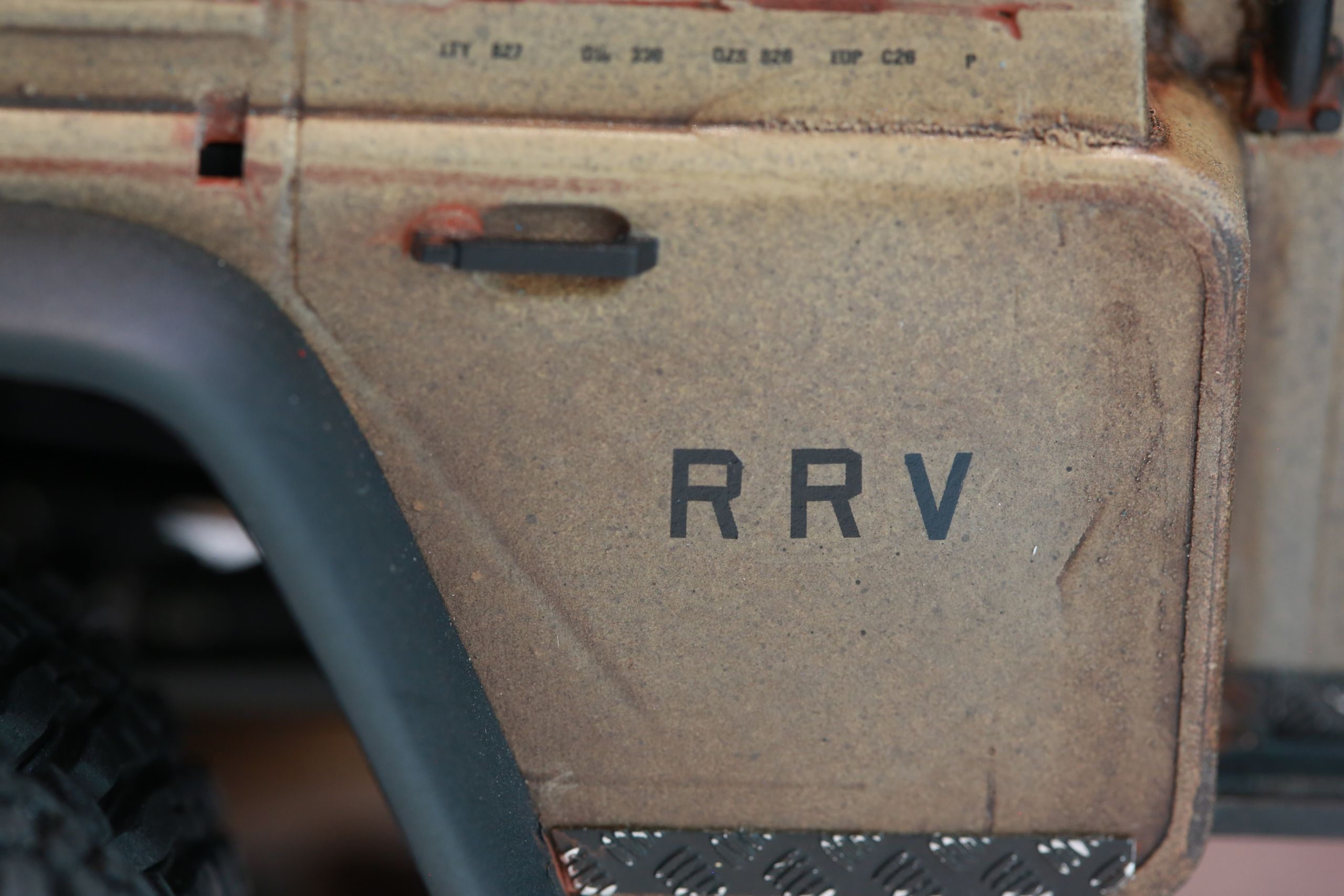 The Land Rover Defender Resource Recovery Vehicle (RRV) is an imagined 1/18 scale post-apocalyptic tanker truck that roams the industrial wasteland harvesting fuel from abandoned sites for transport back to the survivor encampment.