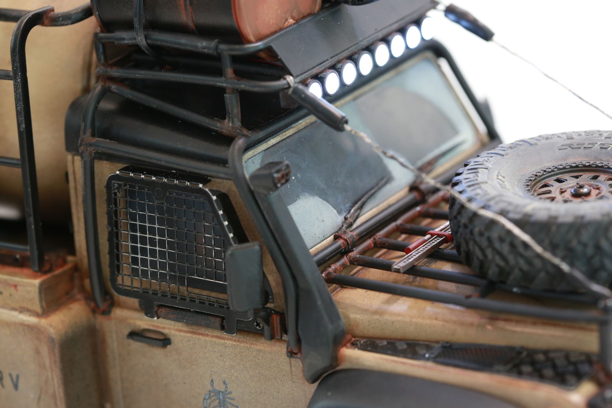 The Land Rover Defender Resource Recovery Vehicle (RRV) is an imagined 1/18 scale post-apocalyptic tanker truck that roams the industrial wasteland harvesting fuel from abandoned sites for transport back to the survivor encampment.