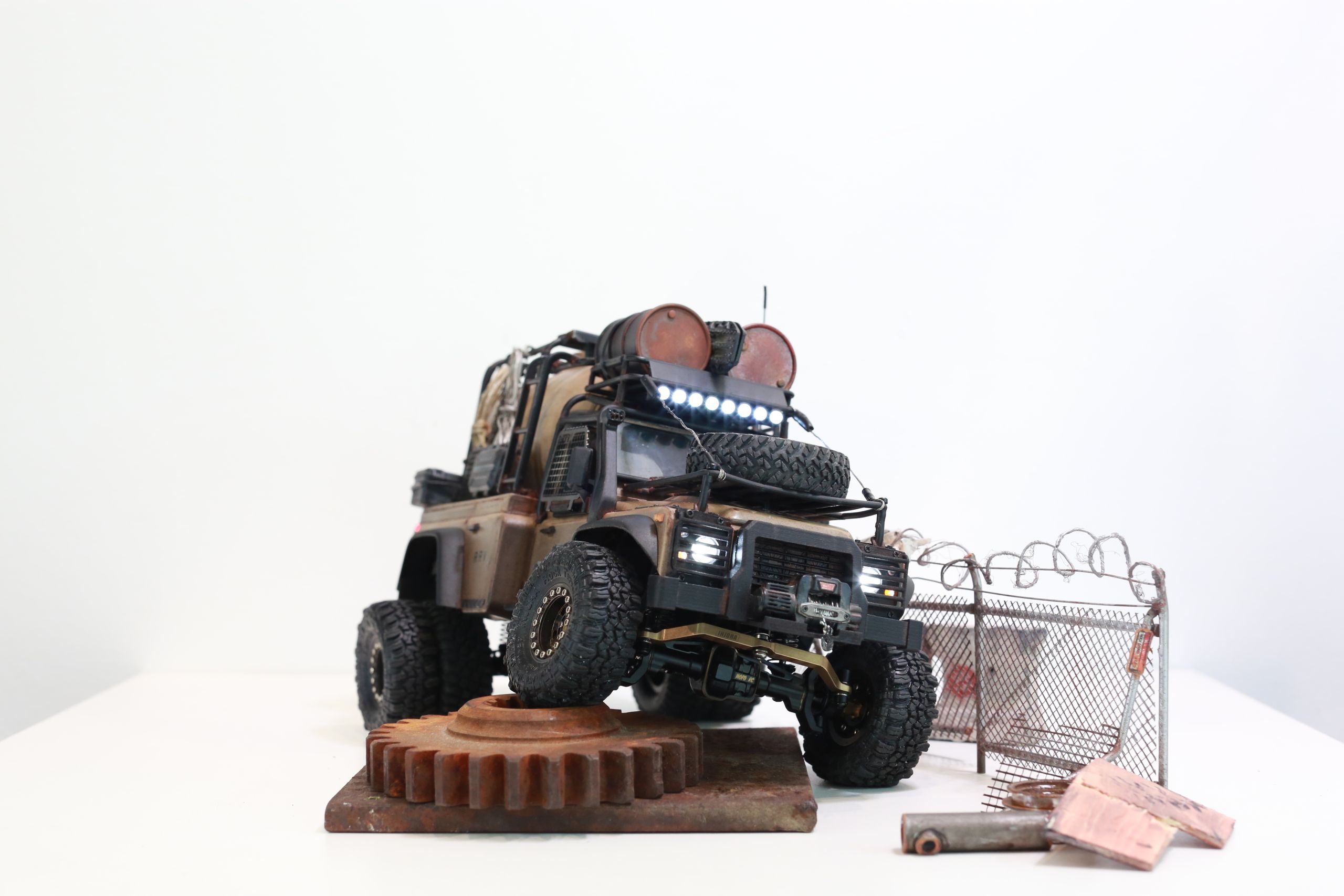 The Land Rover Defender Resource Recovery Vehicle (RRV) is an imagined 1/18 scale post-apocalyptic tanker truck that roams the industrial wasteland harvesting fuel from abandoned sites for transport back to the survivor encampment.