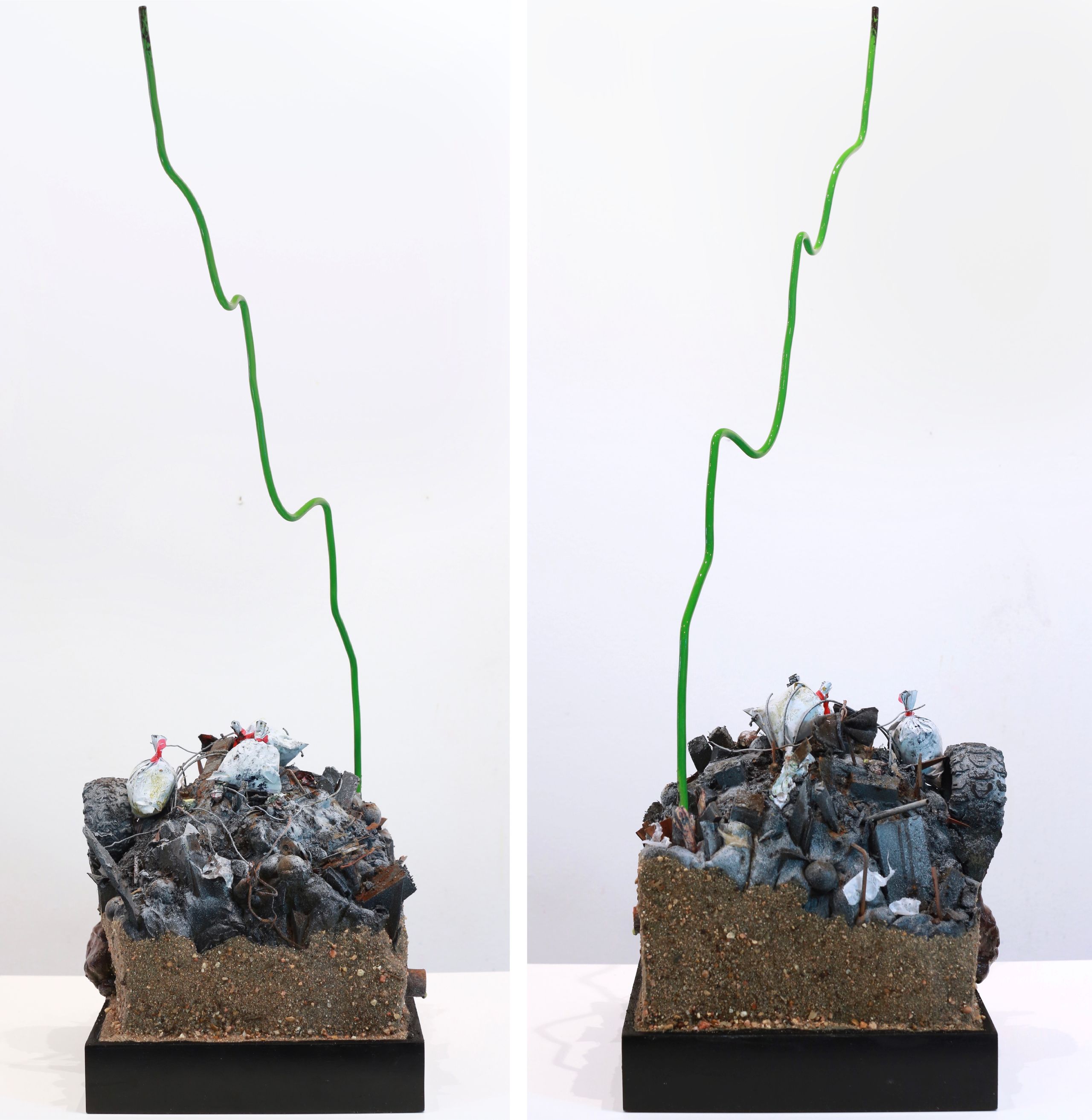Sculpture made from Plastic, wood, foam, metal, wire, fabric, paint, paper, rubber, cardboard, CA glue, dirt, found objects with commentary on unsustainable economic, urban, and population growth on a finite planet, with a green stock market ticker rising above the wasteland symbolizing the piece's title, a popular stock market and cryptocurrency slogan
