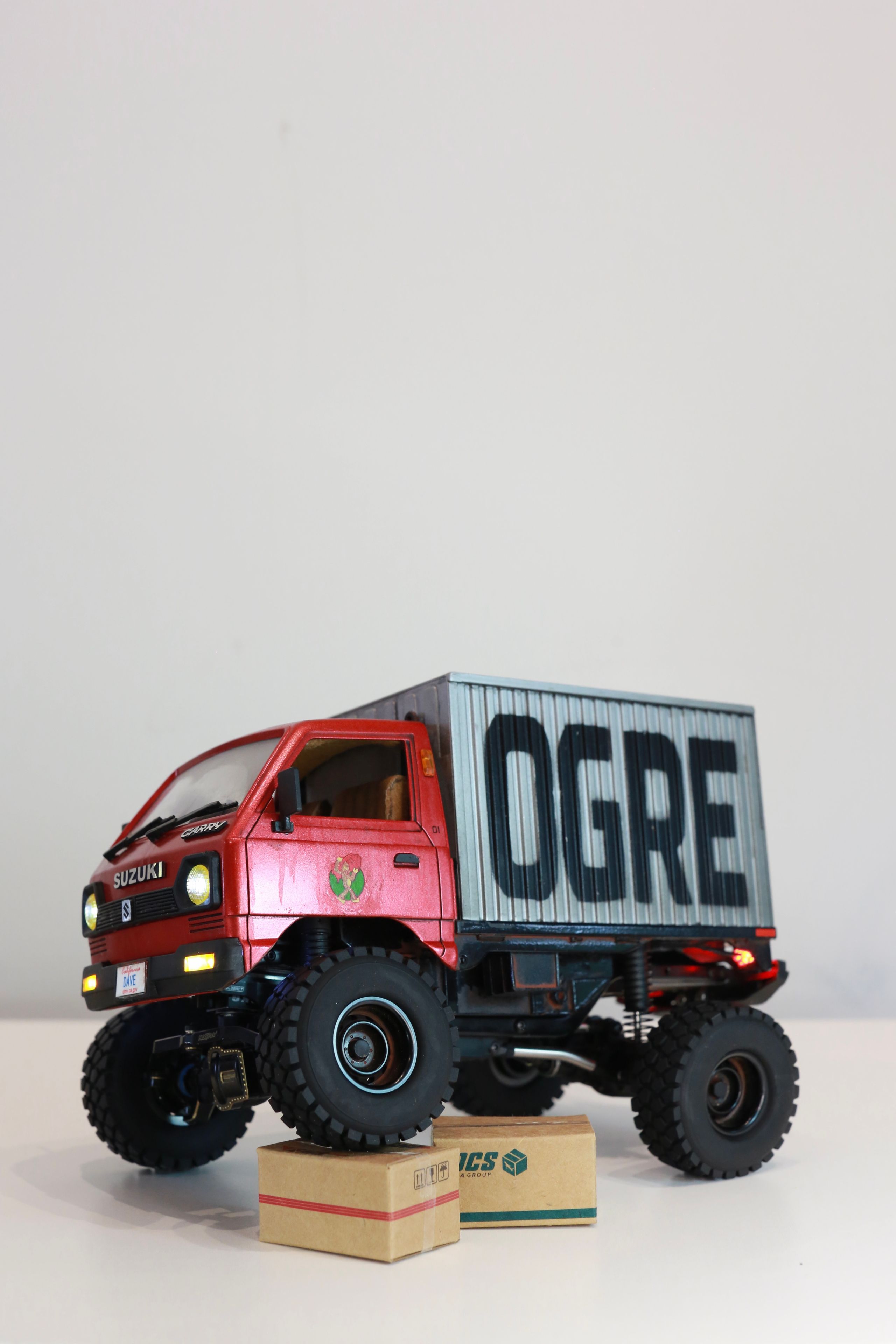 1/24 scale Kei truck body on a 1/18 scale RC chassis tribute by artist nick baxter to tattoo client and friend Dave who owns Austin Texas-based moving company Ogre Man Movers
