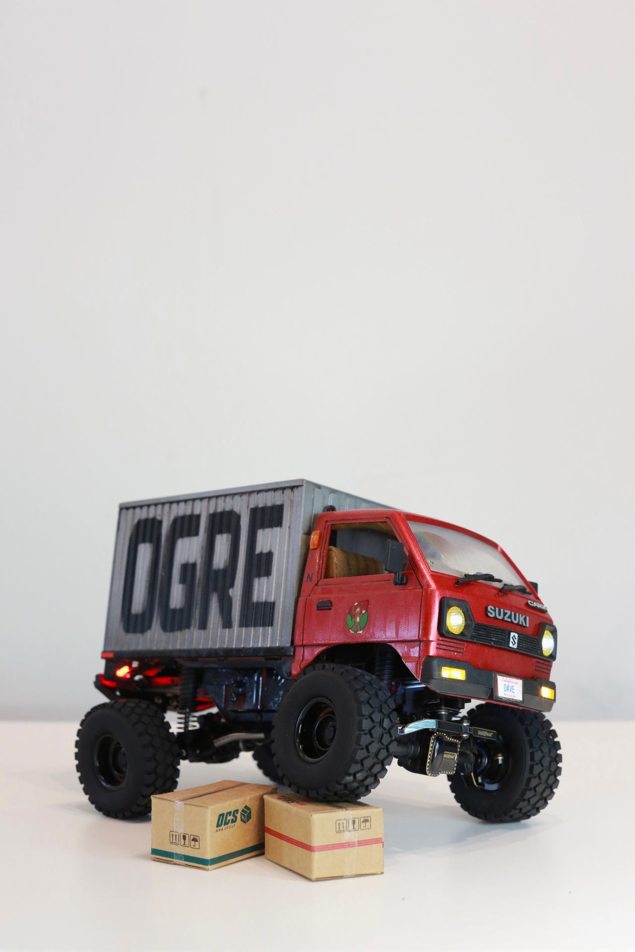 1/24 scale Kei truck body on a 1/18 scale RC chassis tribute by artist nick baxter to tattoo client and friend Dave who owns Austin Texas-based moving company Ogre Man Movers