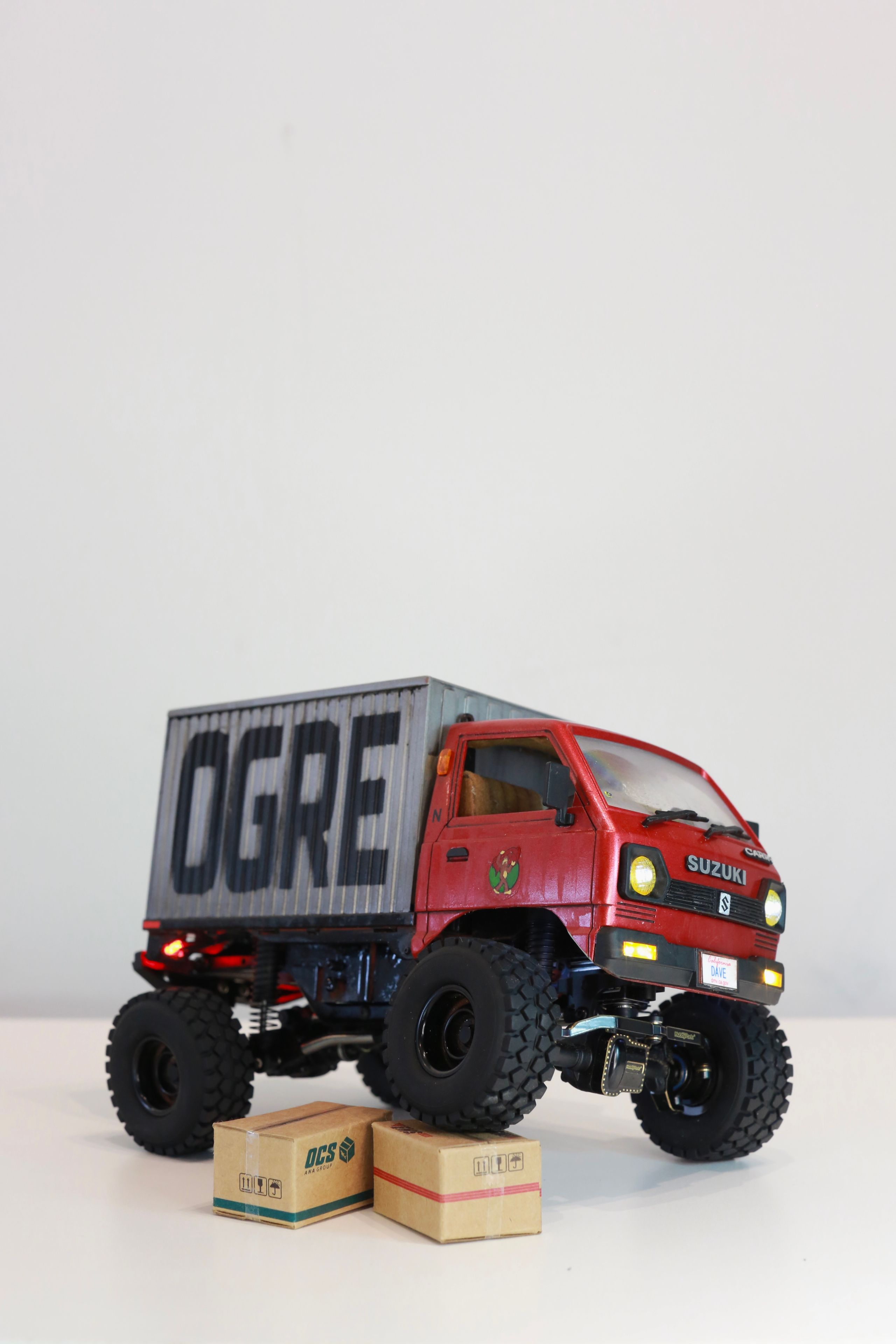 1/24 scale Kei truck body on a 1/18 scale RC chassis tribute by artist nick baxter to tattoo client and friend Dave who owns Austin Texas-based moving company Ogre Man Movers