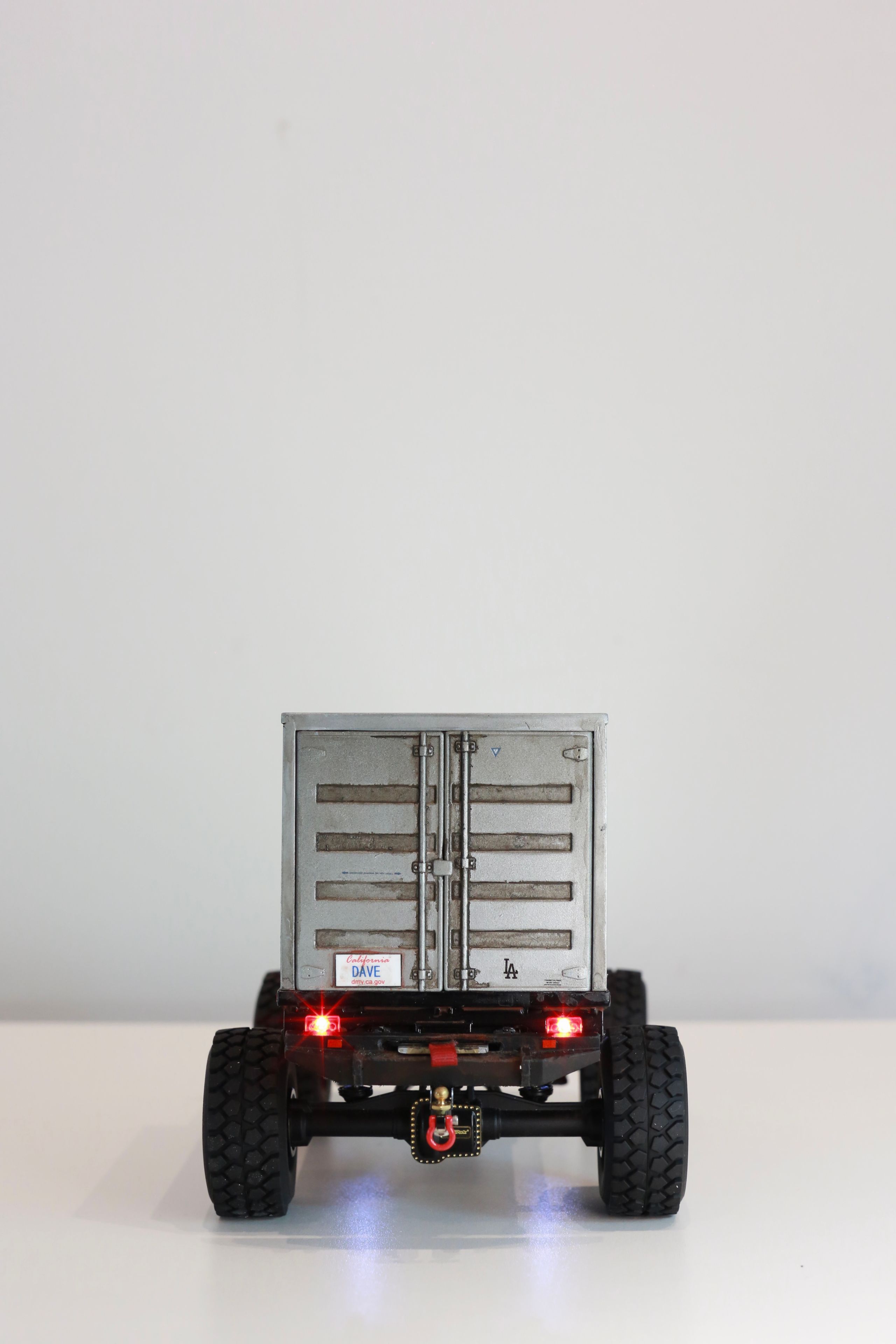 1/24 scale Kei truck body on a 1/18 scale RC chassis tribute by artist nick baxter to tattoo client and friend Dave who owns Austin Texas-based moving company Ogre Man Movers