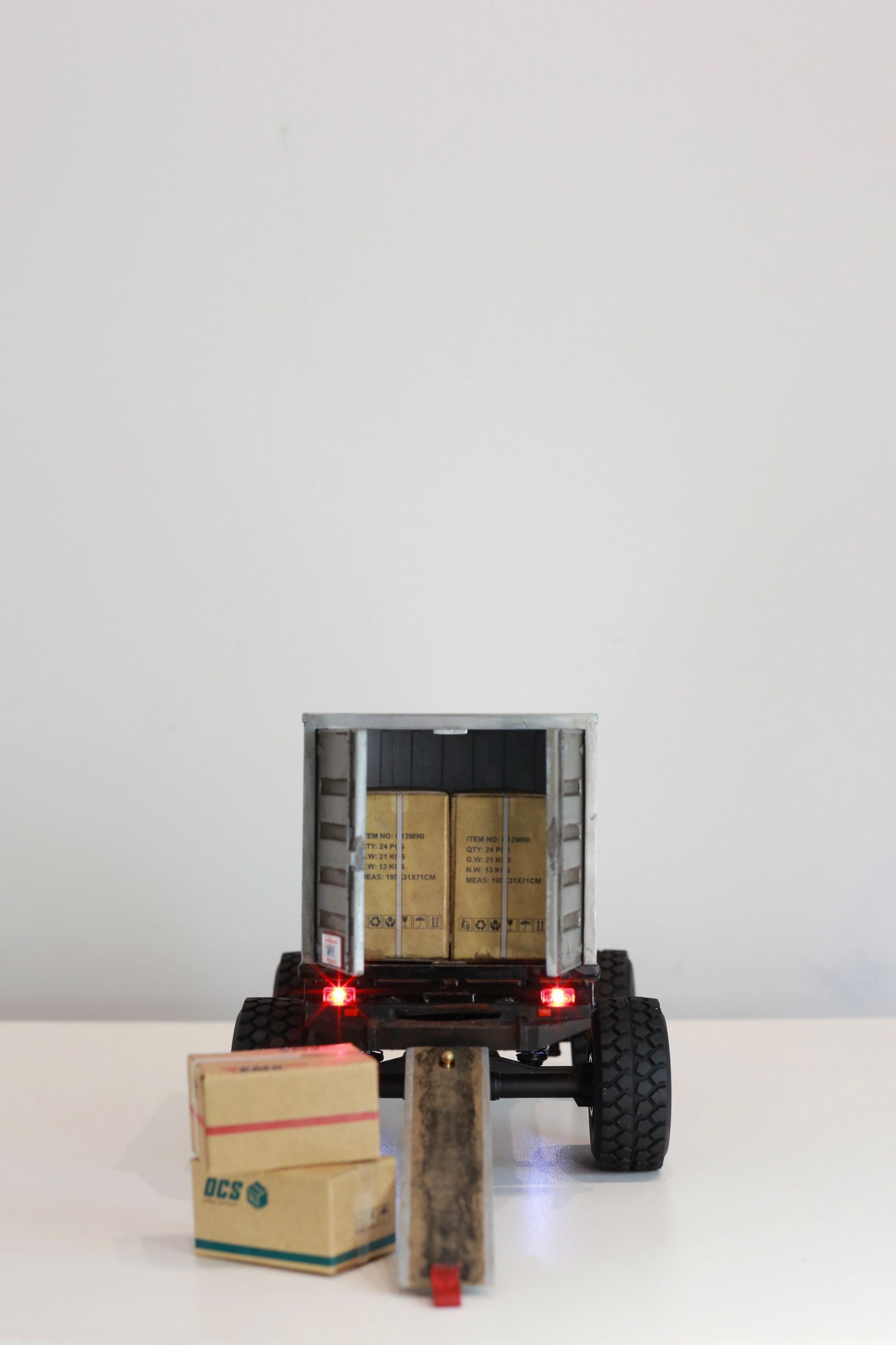 1/24 scale Kei truck body on a 1/18 scale RC chassis tribute by artist nick baxter to tattoo client and friend Dave who owns Austin Texas-based moving company Ogre Man Movers