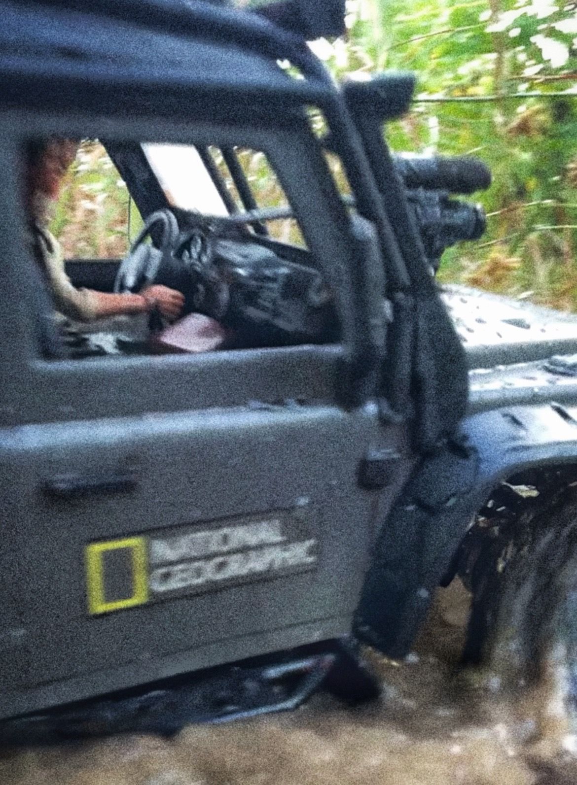 1/10 scale RC Defender 110 build inspired by the heavily modified and customized Land Rover Defenders used by National Geographic photographers in the 80s and 90s in places like the African savanna, featuring a custom cab interior and rear camera platforms, as well as many handmade accessories constructed from found objects and household junk.