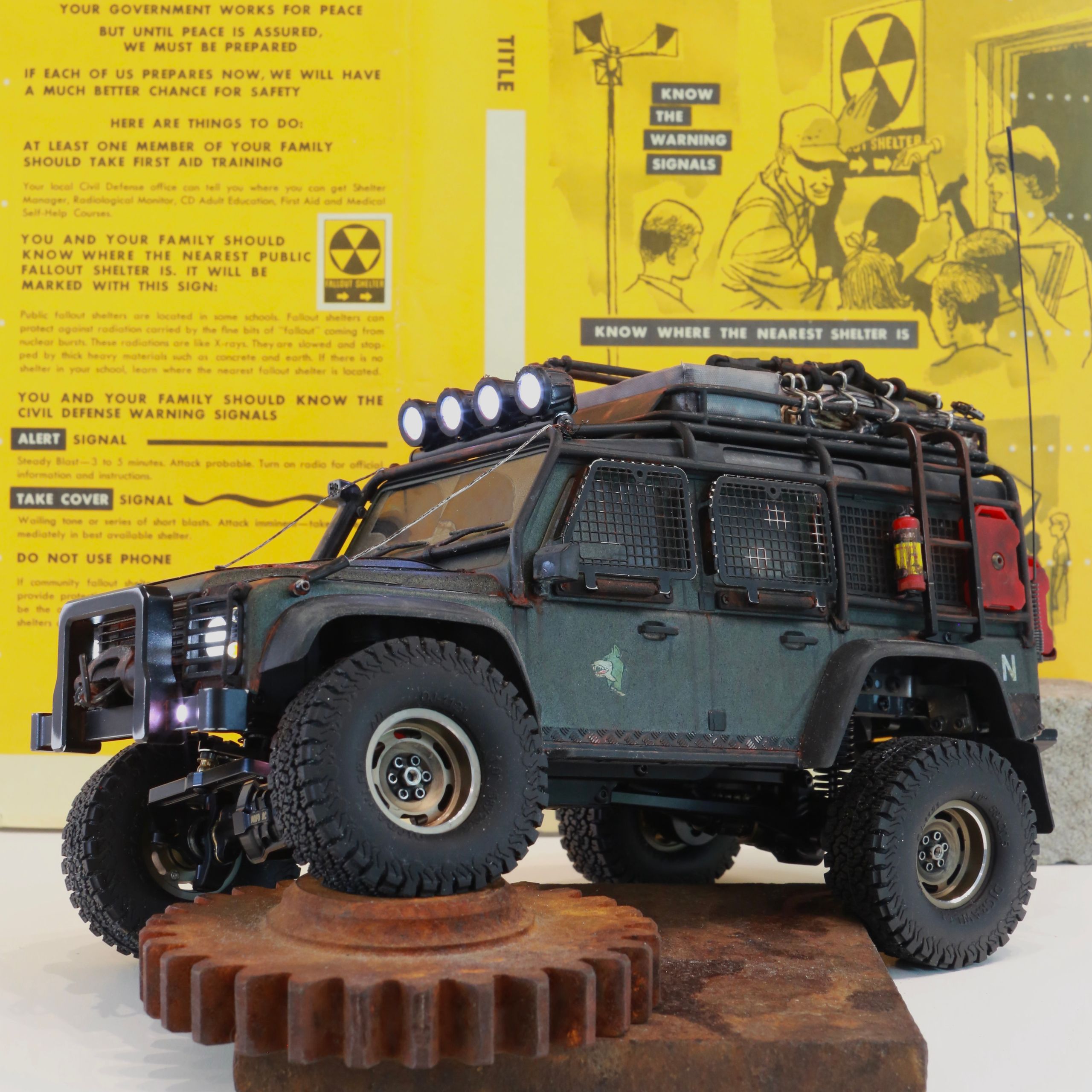 1/18 scale RC Land Rover Defender build inspired by post-apocalyptic franchises like "The Last Of Us" and "28 Days Later" featuring a working winch constructed from a retractable lanyard spool mounted underneath the hood.