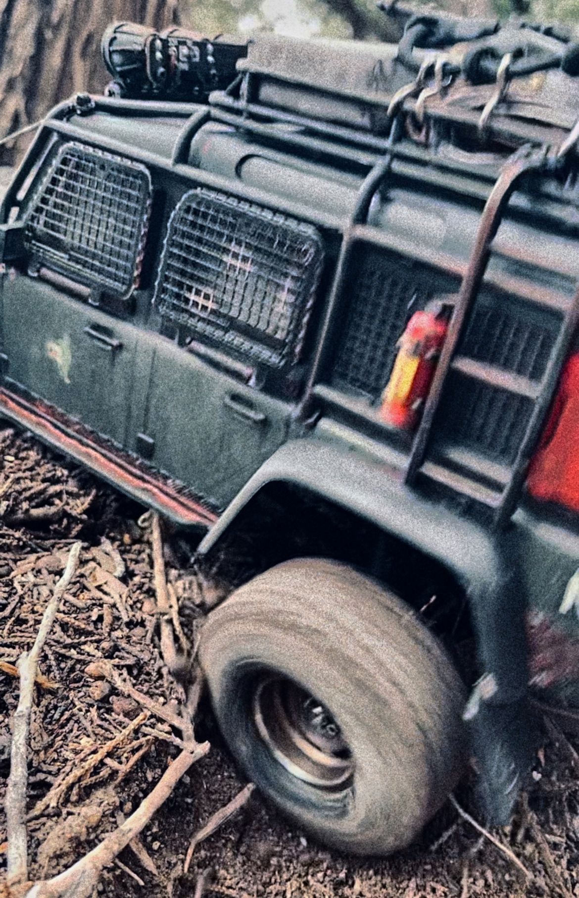 1/18 scale RC Land Rover Defender build inspired by post-apocalyptic franchises like "The Last Of Us" and "28 Days Later" featuring a working winch constructed from a retractable lanyard spool mounted underneath the hood.