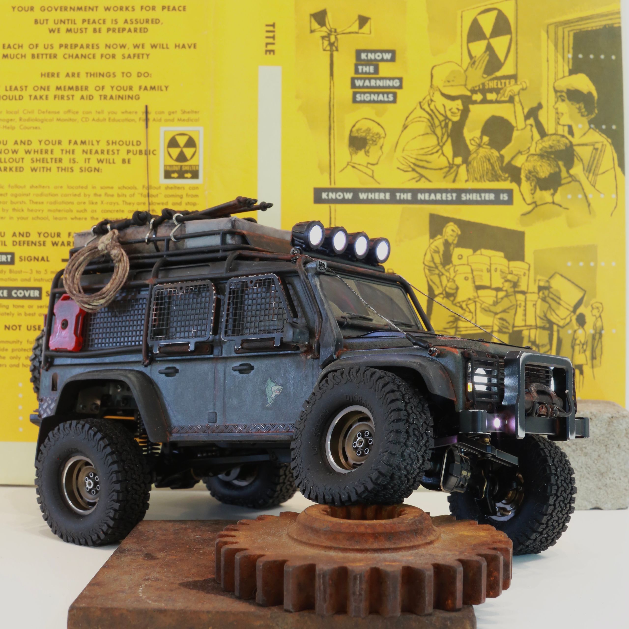1/18 scale RC Land Rover Defender build inspired by post-apocalyptic franchises like "The Last Of Us" and "28 Days Later" featuring a working winch constructed from a retractable lanyard spool mounted underneath the hood.