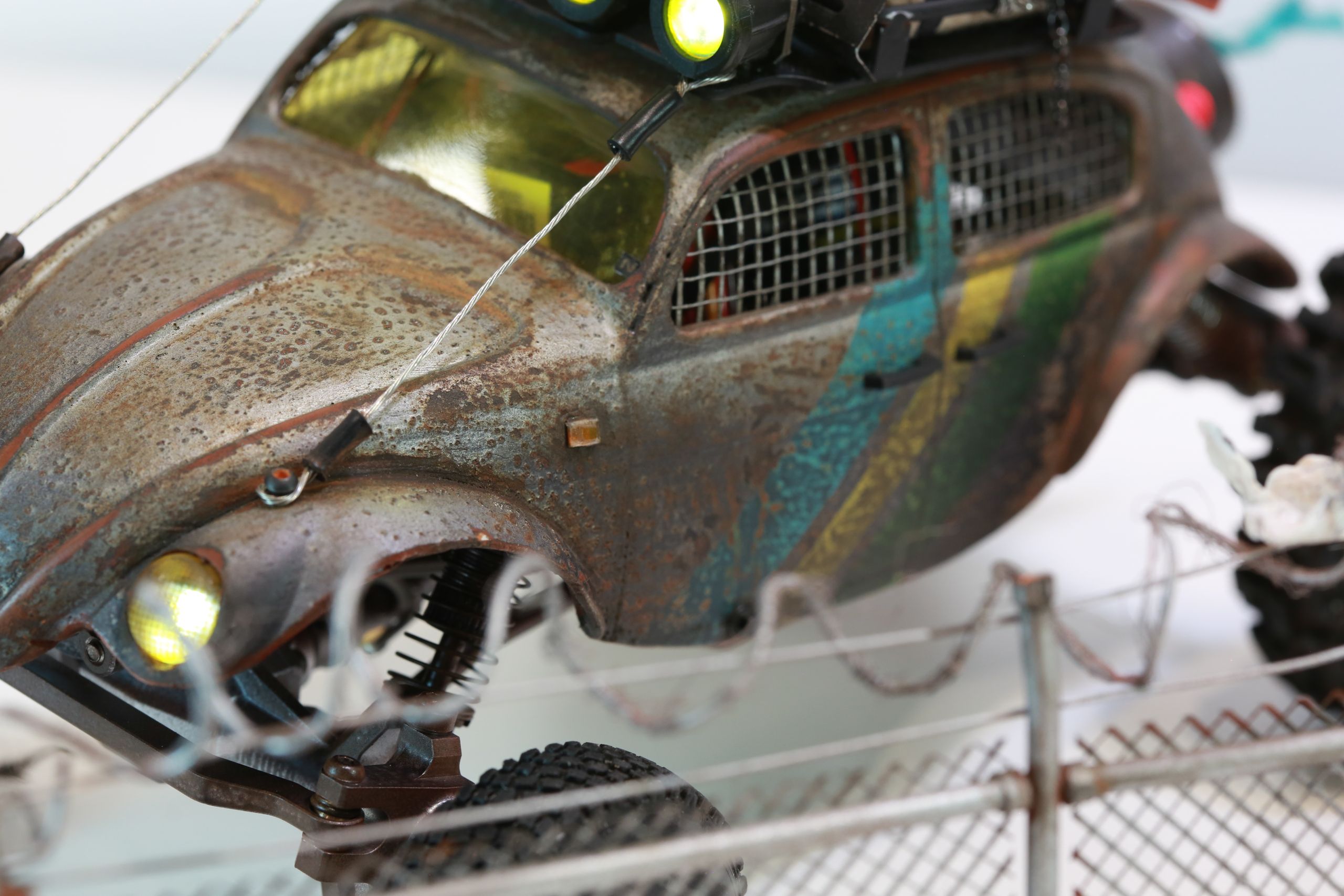 1/18 scale post-apocalyptic old desert Volkswagen Beetle fast transport vehicle by artist nick baxter in austin texas featuring working blower fan with tissue paper streamers