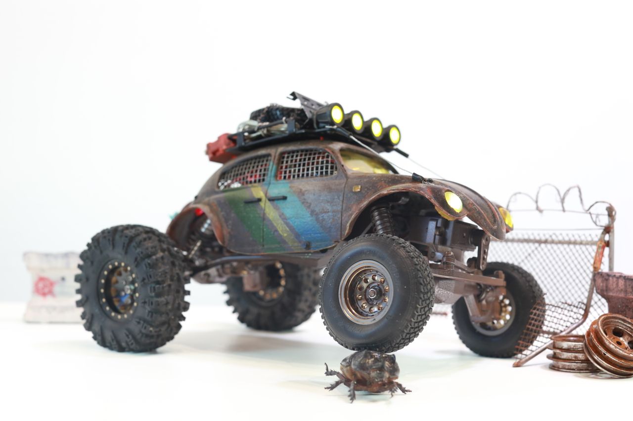 1/18 scale post-apocalyptic old desert Volkswagen Beetle fast transport vehicle by artist nick baxter in austin texas featuring working blower fan with tissue paper streamers