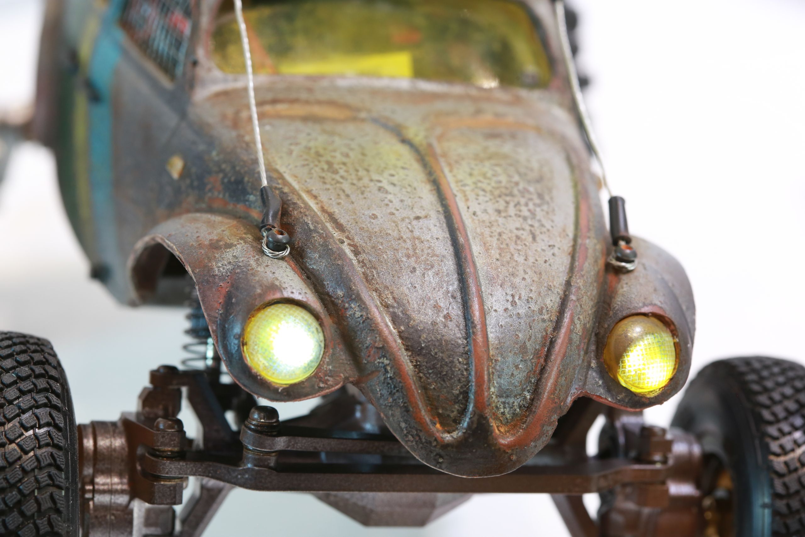 1/18 scale post-apocalyptic old desert Volkswagen Beetle fast transport vehicle by artist nick baxter in austin texas featuring working blower fan with tissue paper streamers