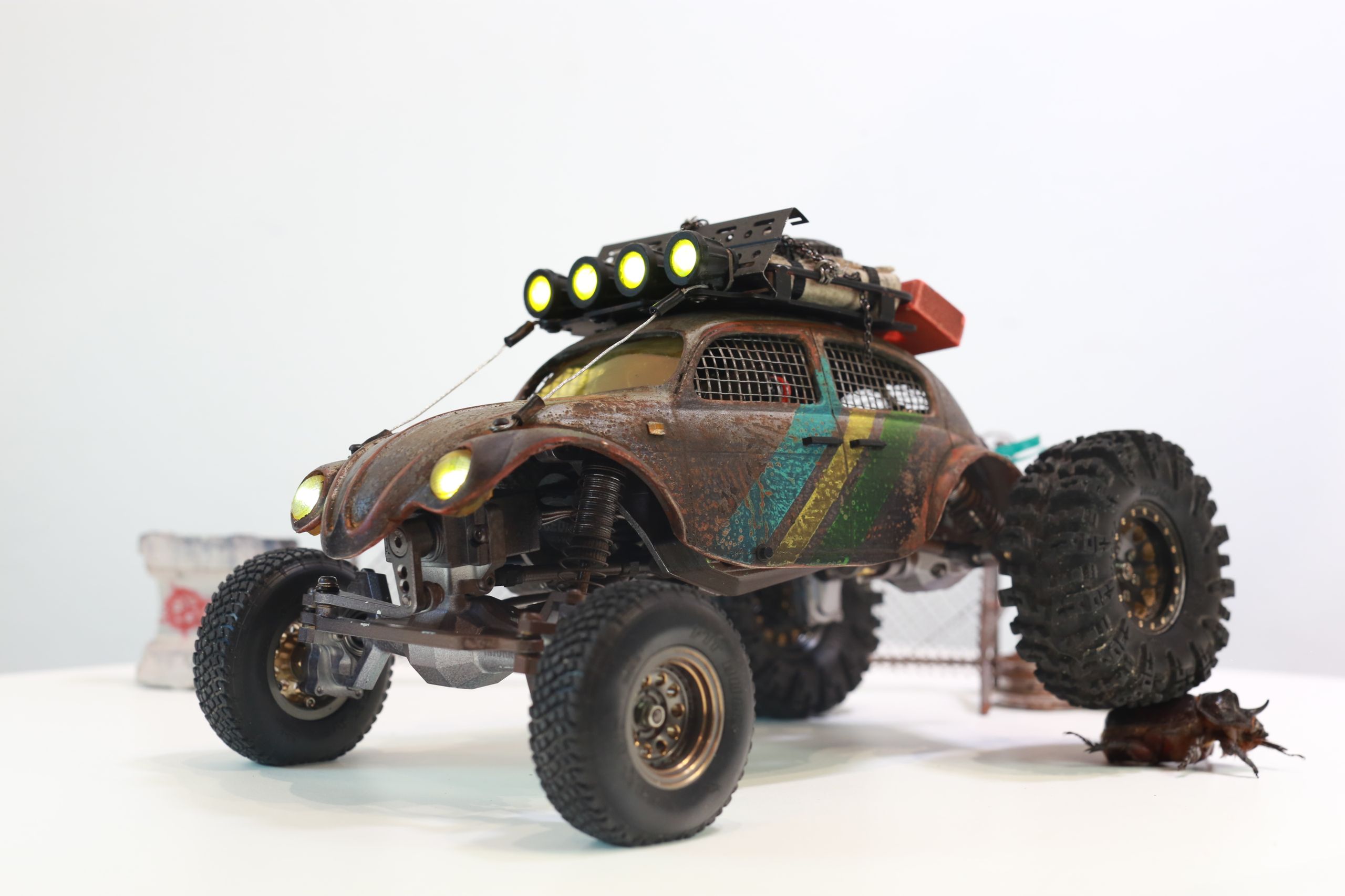 1/18 scale post-apocalyptic old desert Volkswagen Beetle fast transport vehicle by artist nick baxter in austin texas featuring working blower fan with tissue paper streamers