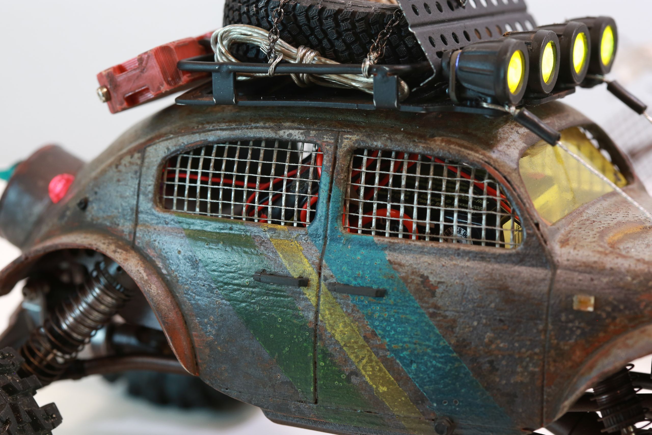 1/18 scale post-apocalyptic old desert Volkswagen Beetle fast transport vehicle by artist nick baxter in austin texas featuring working blower fan with tissue paper streamers