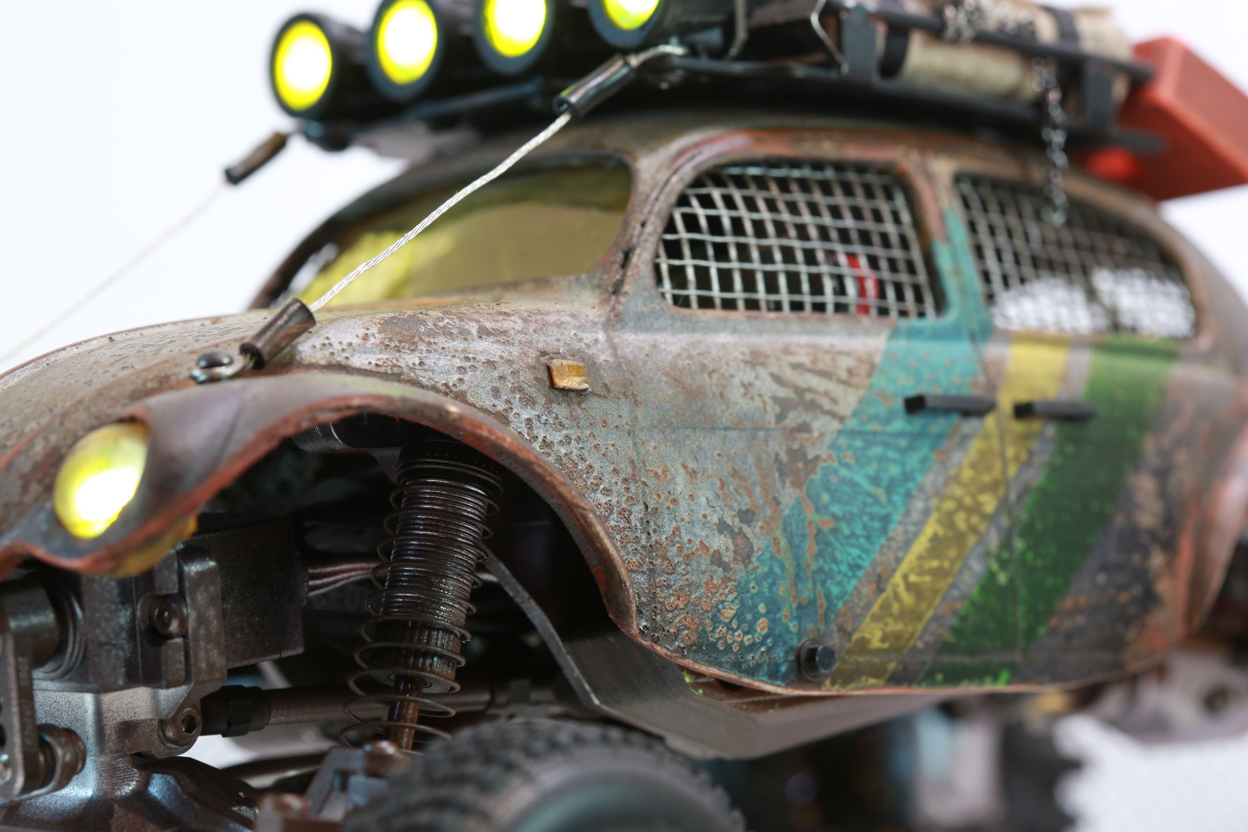 1/18 scale post-apocalyptic old desert Volkswagen Beetle fast transport vehicle by artist nick baxter in austin texas featuring working blower fan with tissue paper streamers