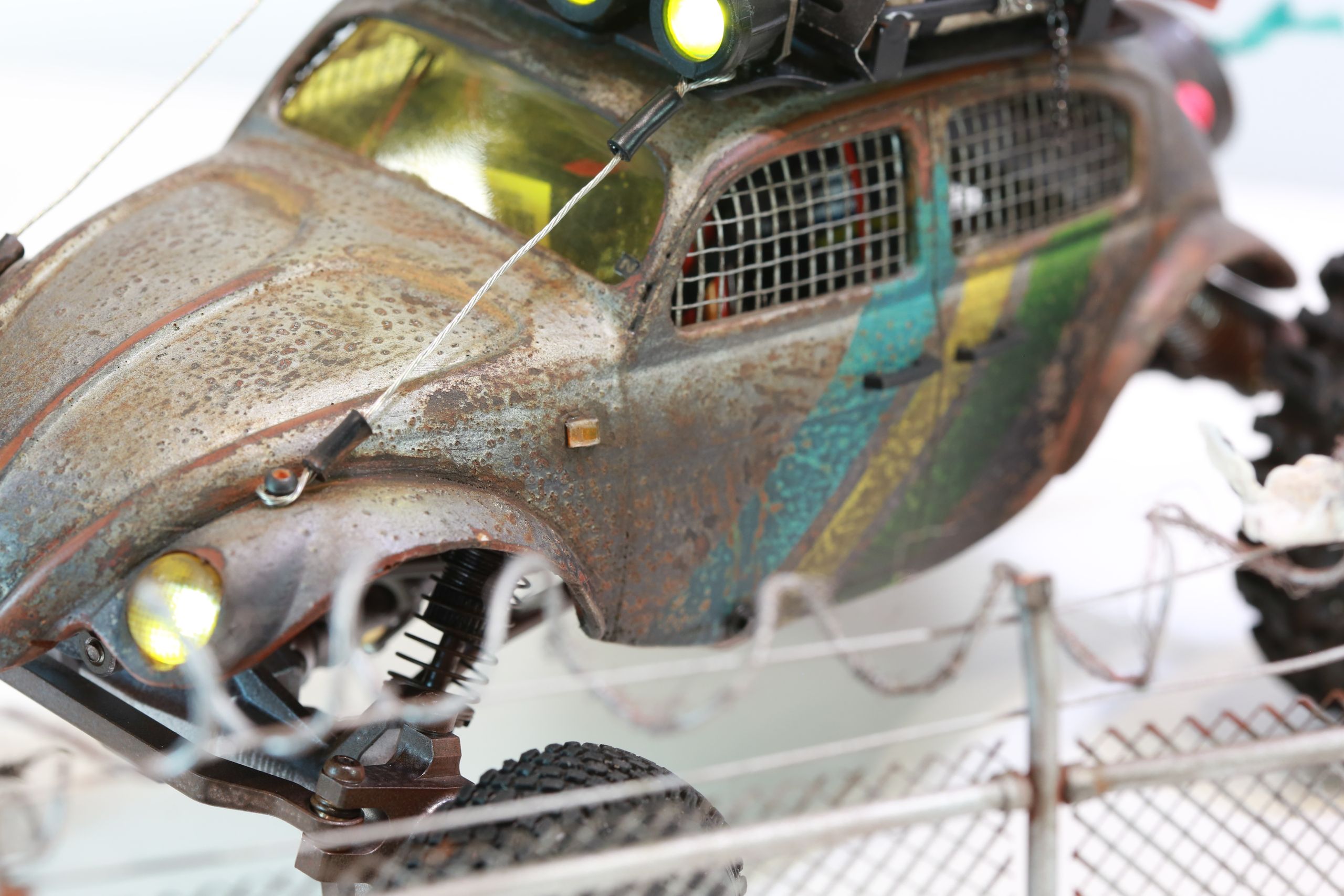 1/18 scale post-apocalyptic old desert Volkswagen Beetle fast transport vehicle by artist nick baxter in austin texas featuring working blower fan with tissue paper streamers