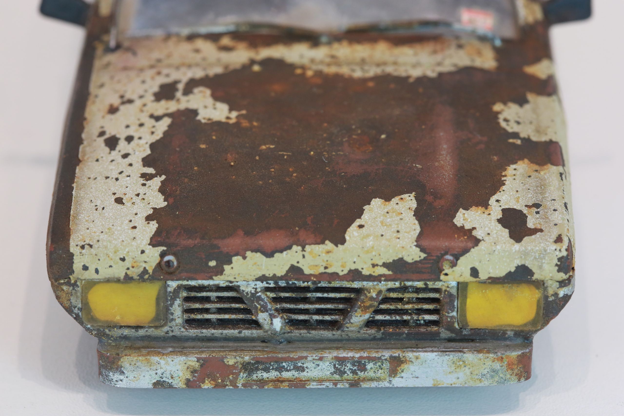 Old junkyard Nissan 1/24 scale 3d printed pickup body for scx24 RC truck with real rust patina, dents, duct tape windows, and custom bumpers.
