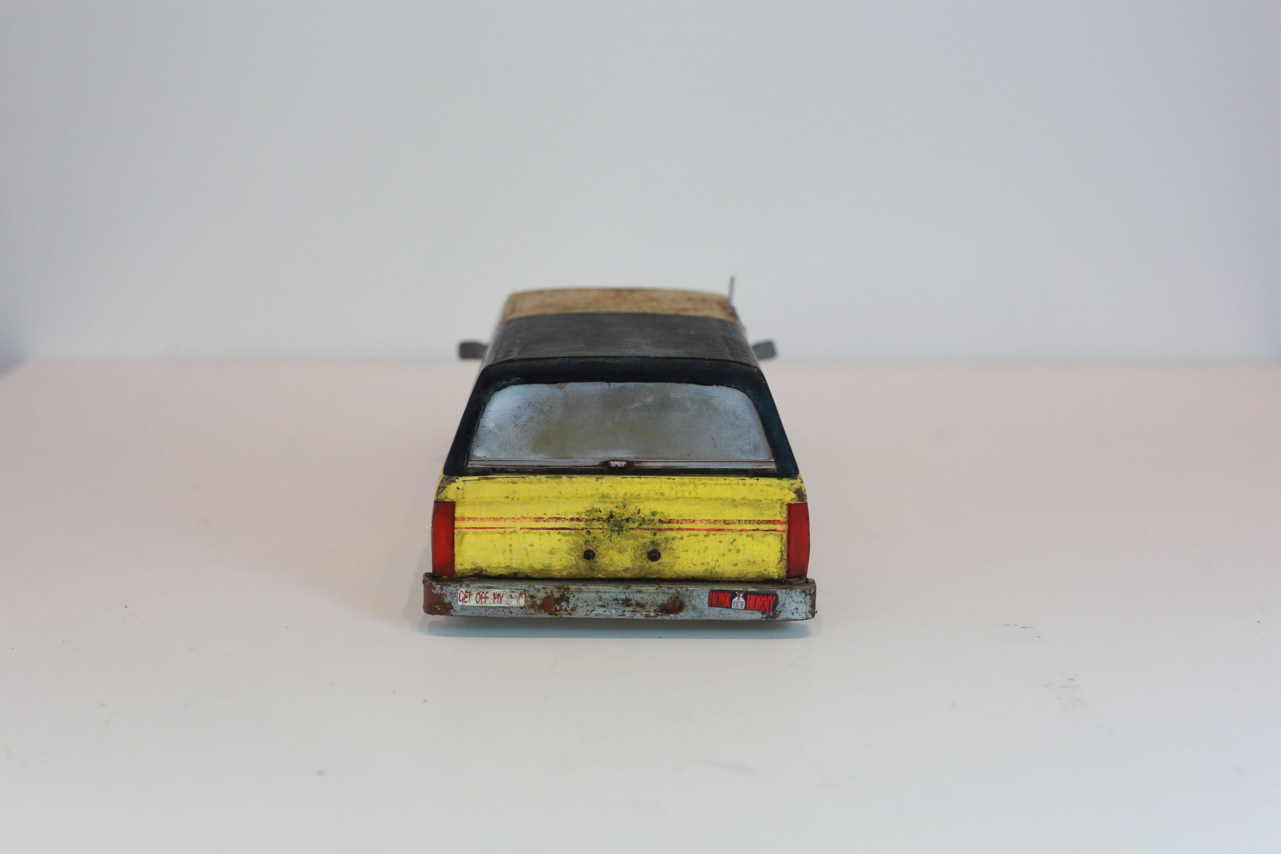 Old junkyard Nissan 1/24 scale 3d printed pickup body for scx24 RC truck with real rust patina, dents, duct tape windows, and custom bumpers.