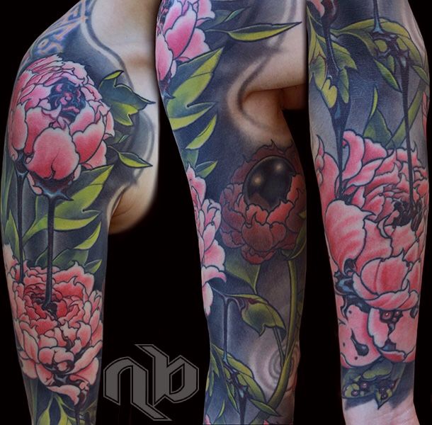 full arm sleeve tattoo coverup of laser-lightened tattoos, pairing contrasting symbolic opposites of delicate peonies with dripping blood, and a black pearl on the inner bicep.