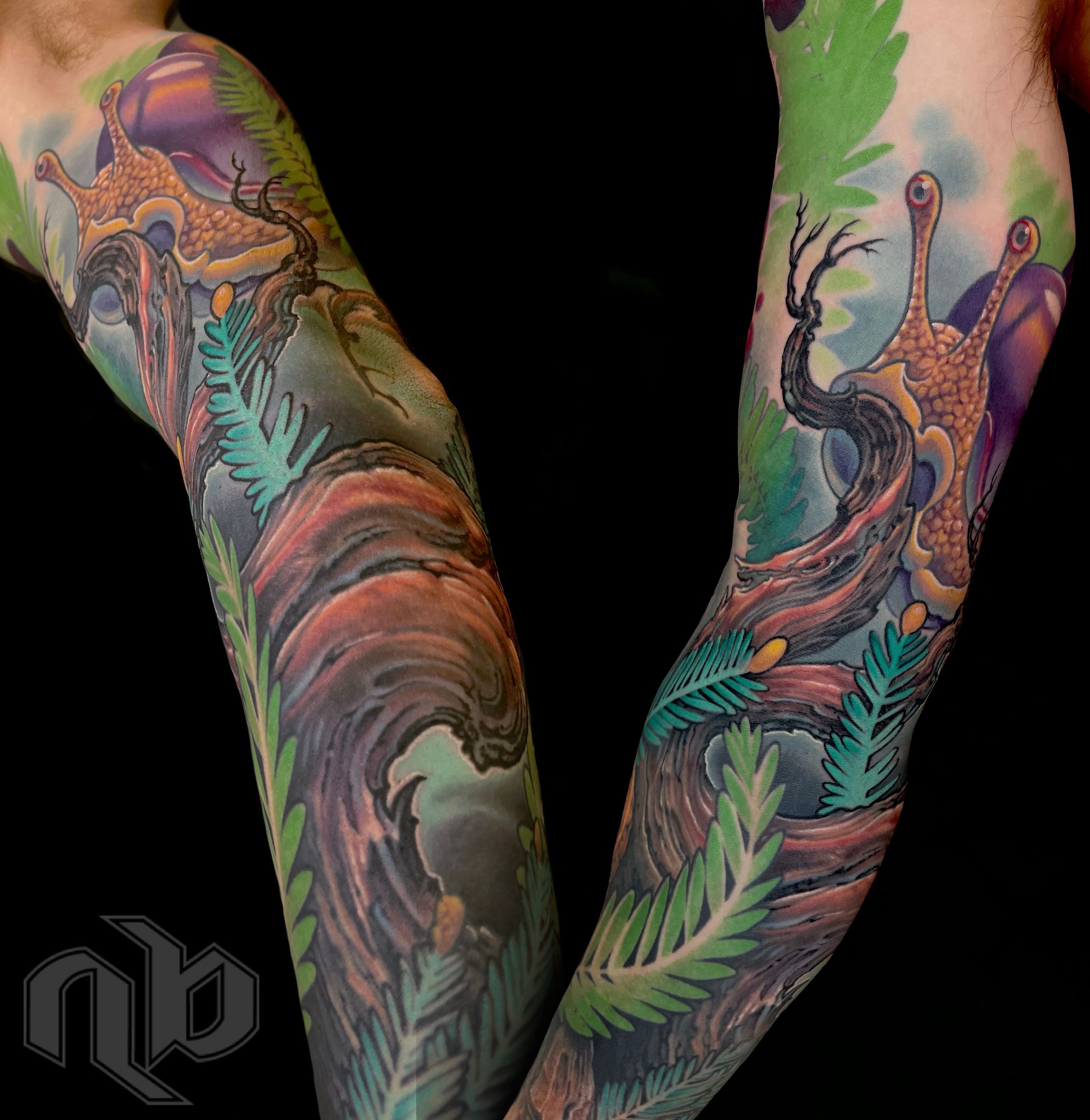 color tattoo of twisted tree, snail, banana slug, and berries in a landscape tribute to big sur california by nick baxter in austin texas