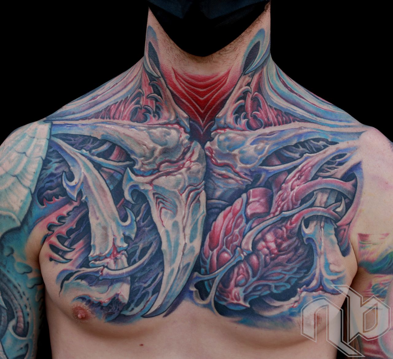 color bio-organic chest tattoo with bone structures and hook formations by nick baxter in austin texas