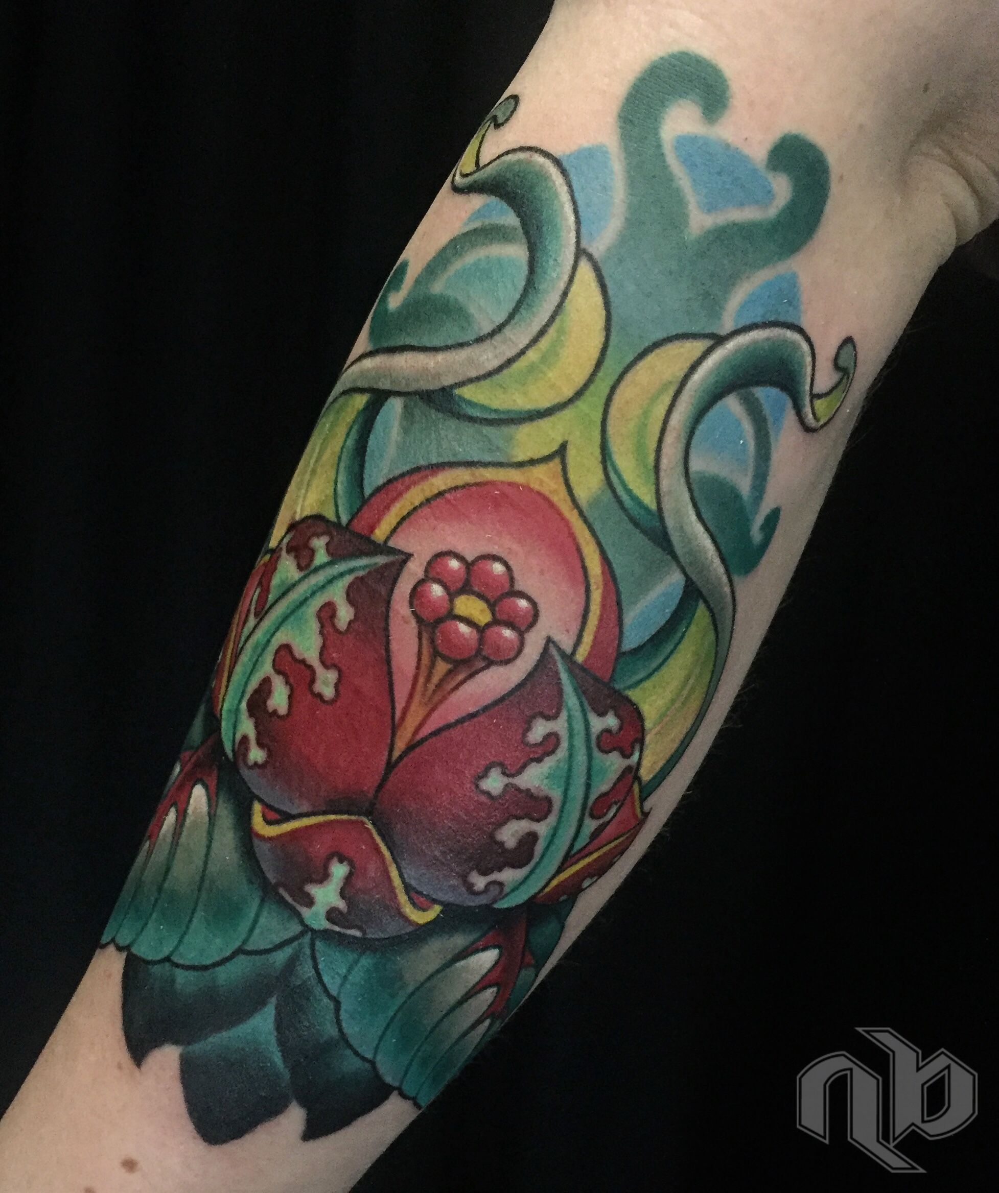 color bio-organic fantasy flower tattoo with curling leaves by nick baxter in austin texas
