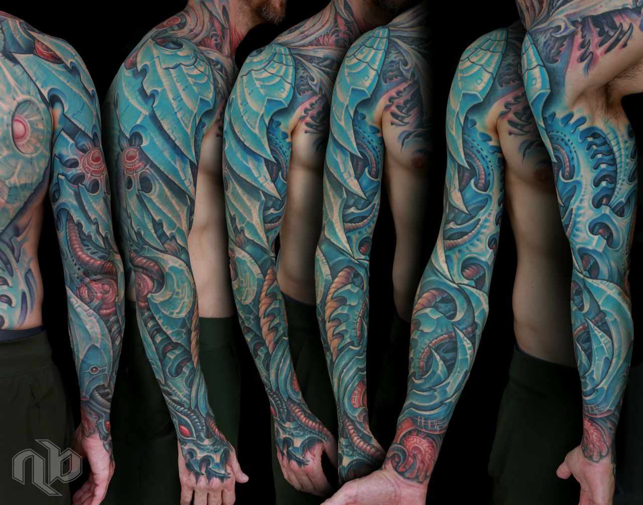 color biomechanical sleeve and back tattoo of blades and cables and robot machinery by nick baxter in austin texas