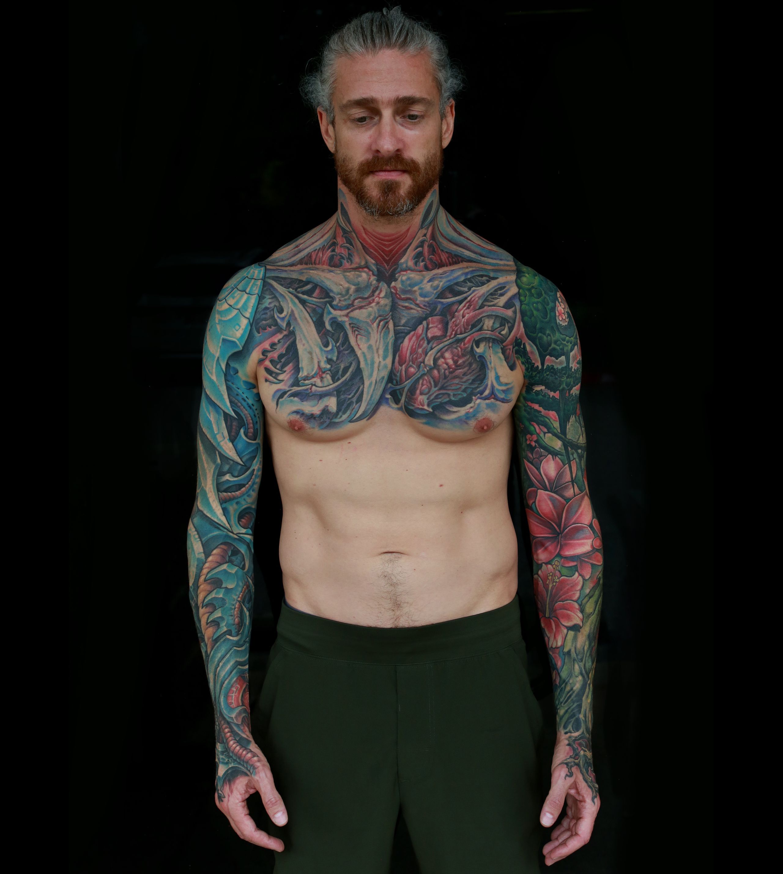 color biomechanical sleeve and back tattoo of blades and cables and robot machinery by nick baxter in austin texas