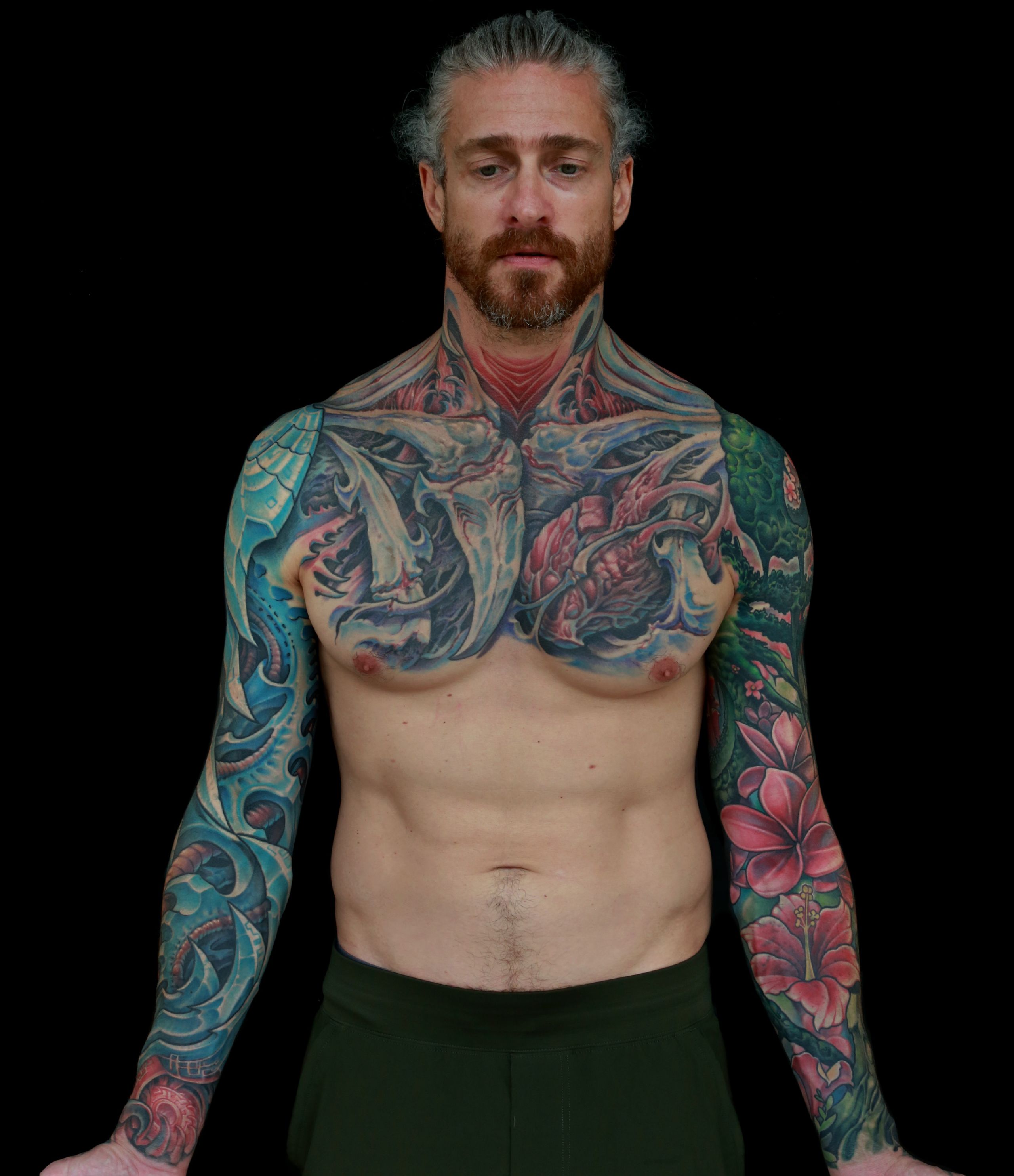 color biomechanical sleeve and back tattoo of blades and cables and robot machinery by nick baxter in austin texas