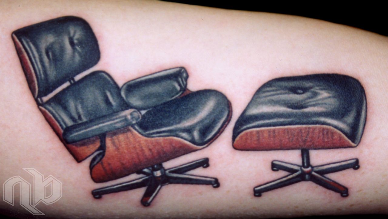color photorealism tattoo of charles eames designer midcentury modern lounge chair furniture by nick baxter in austin texas
