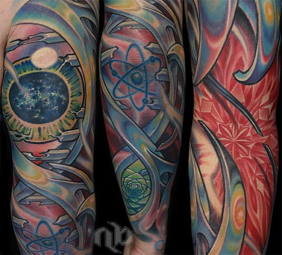 Three close views show a large arm tattoo with an eye, atomic symbol, geometric patterns, and sweeping multicoloured mechanical forms.