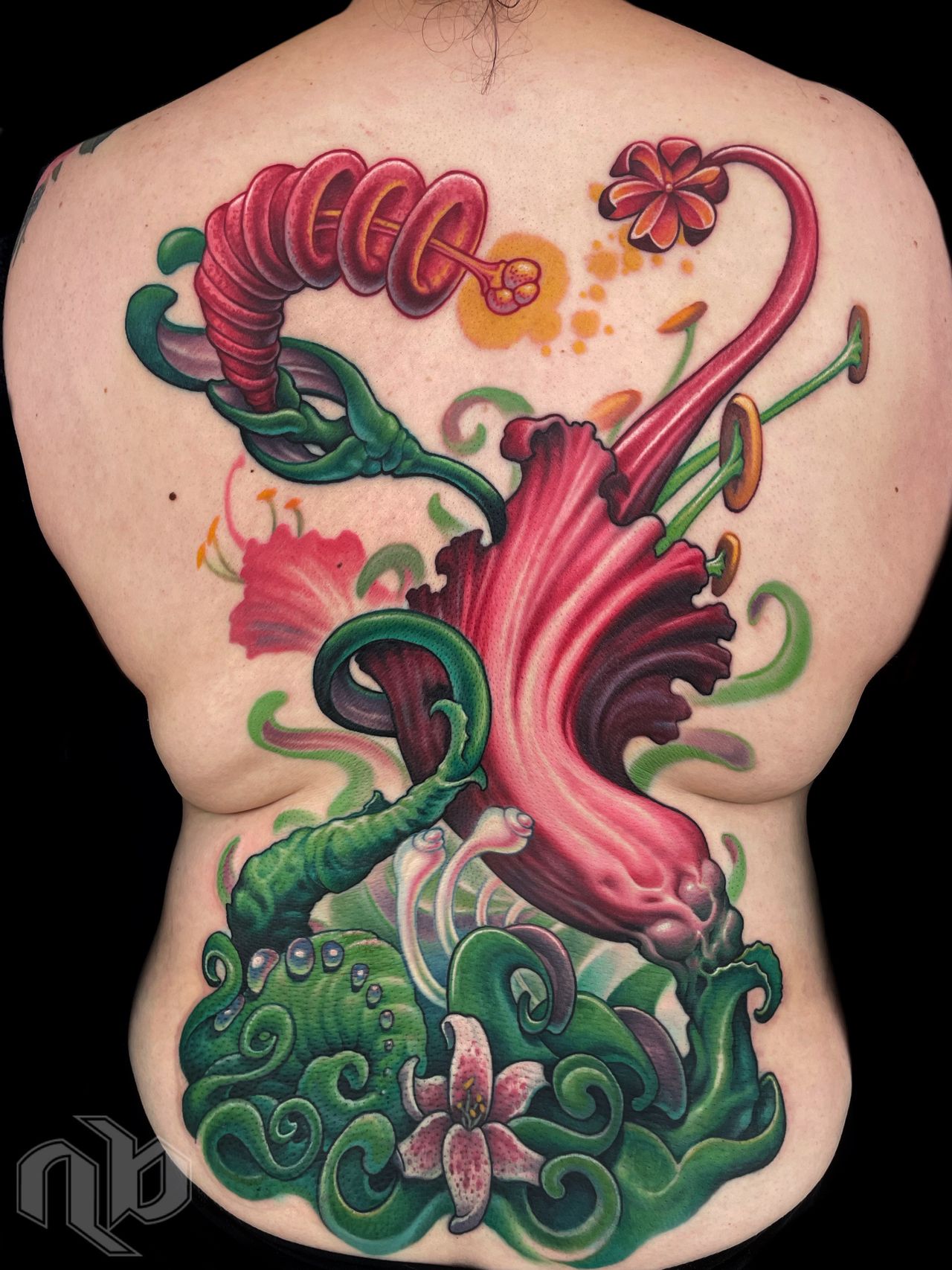 Color bio-organic backpiece tattoo with fantasy flowers and curling vines by nick baxter in austin texas