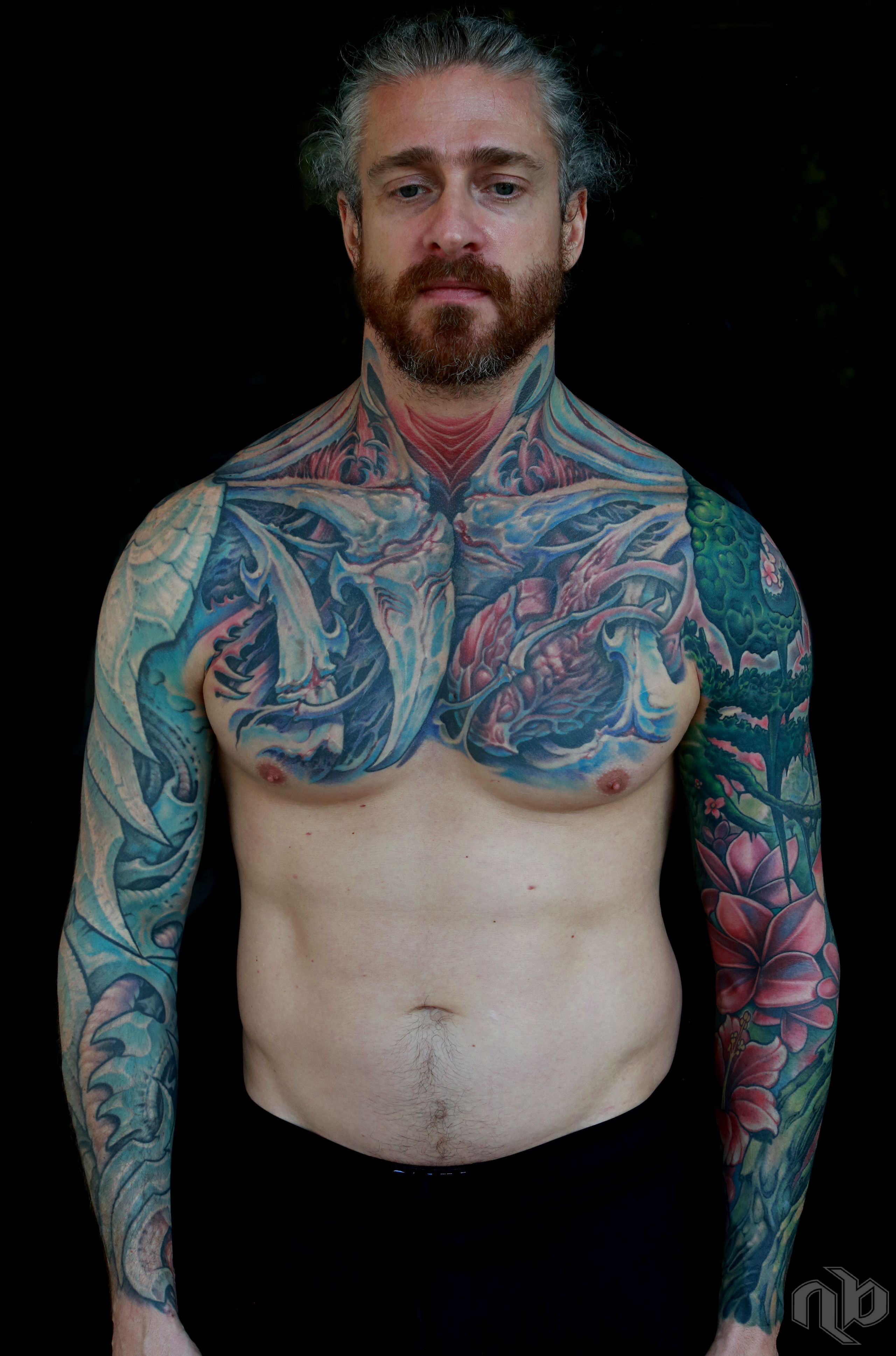 green vines and pink flowers bio organic tattoo sleeve coverup by nick baxter in austin texas